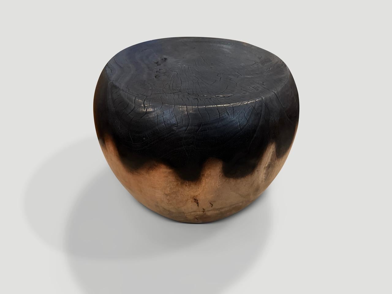 Reclaimed mango wood side table hand carved into an impressive drum shape. We partially stained the top half espresso and left the bottom pale in contrast. Finished with a natural oil revealing the beautiful wood grain. It’s all in the details. Full