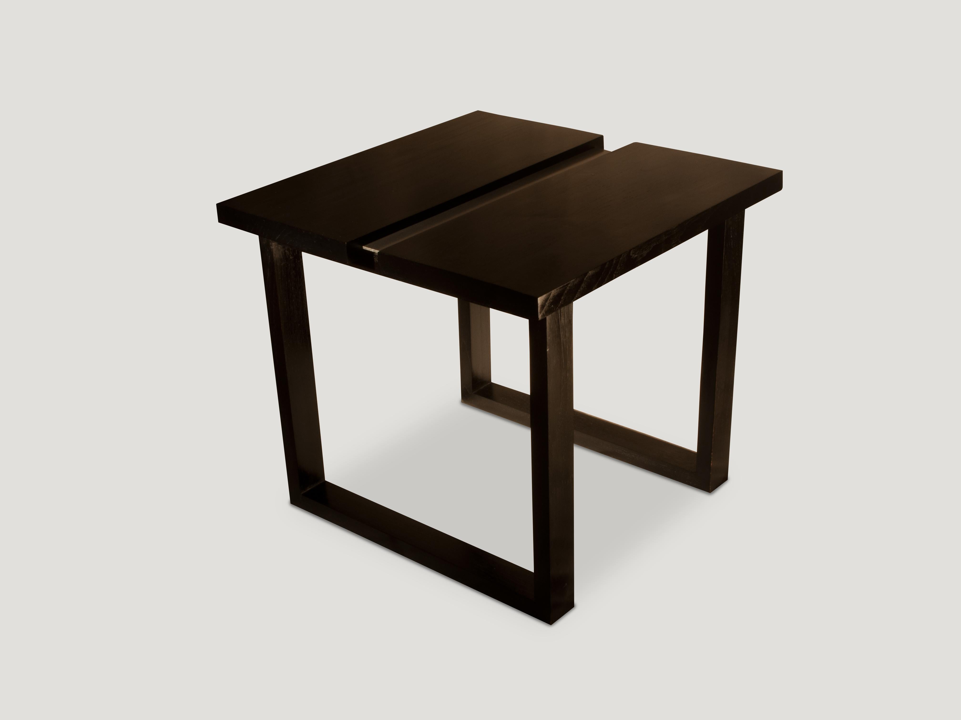 Sleek modern lines on this Minimalist steel and wood side table. We have added an espresso finish to the reclaimed teak wood with a stainless steel center.

Andrianna Shamaris. The Leader In Modern Organic Design.
