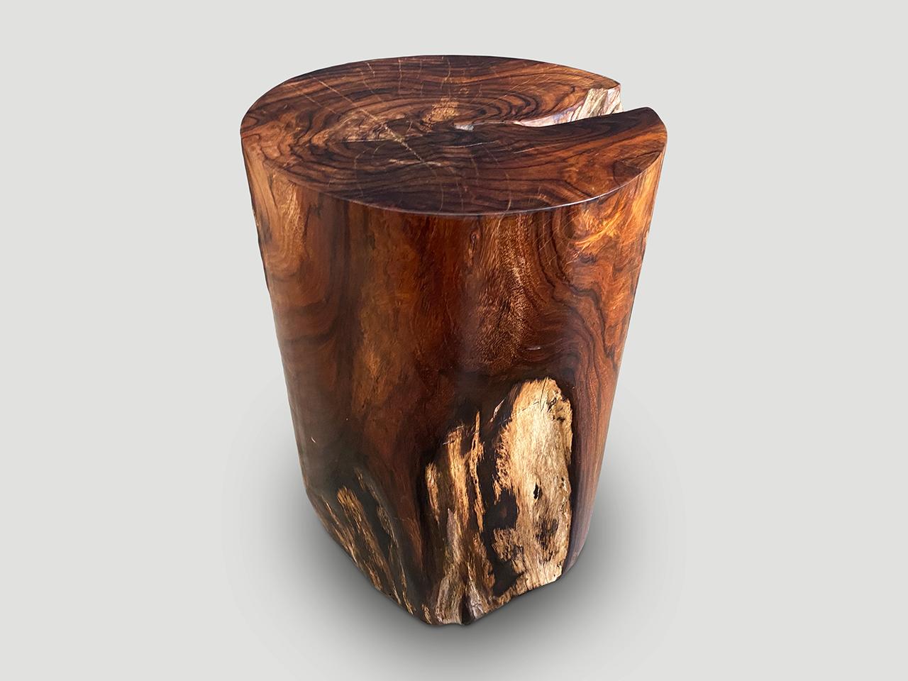 Exquisite rosewood side table with stunning contrasting tones. Finished with a natural oil revealing the beautiful wood grain. We have a collection. The price and images reflect the one shown.

Own an Andrianna Shamaris original.

Andrianna