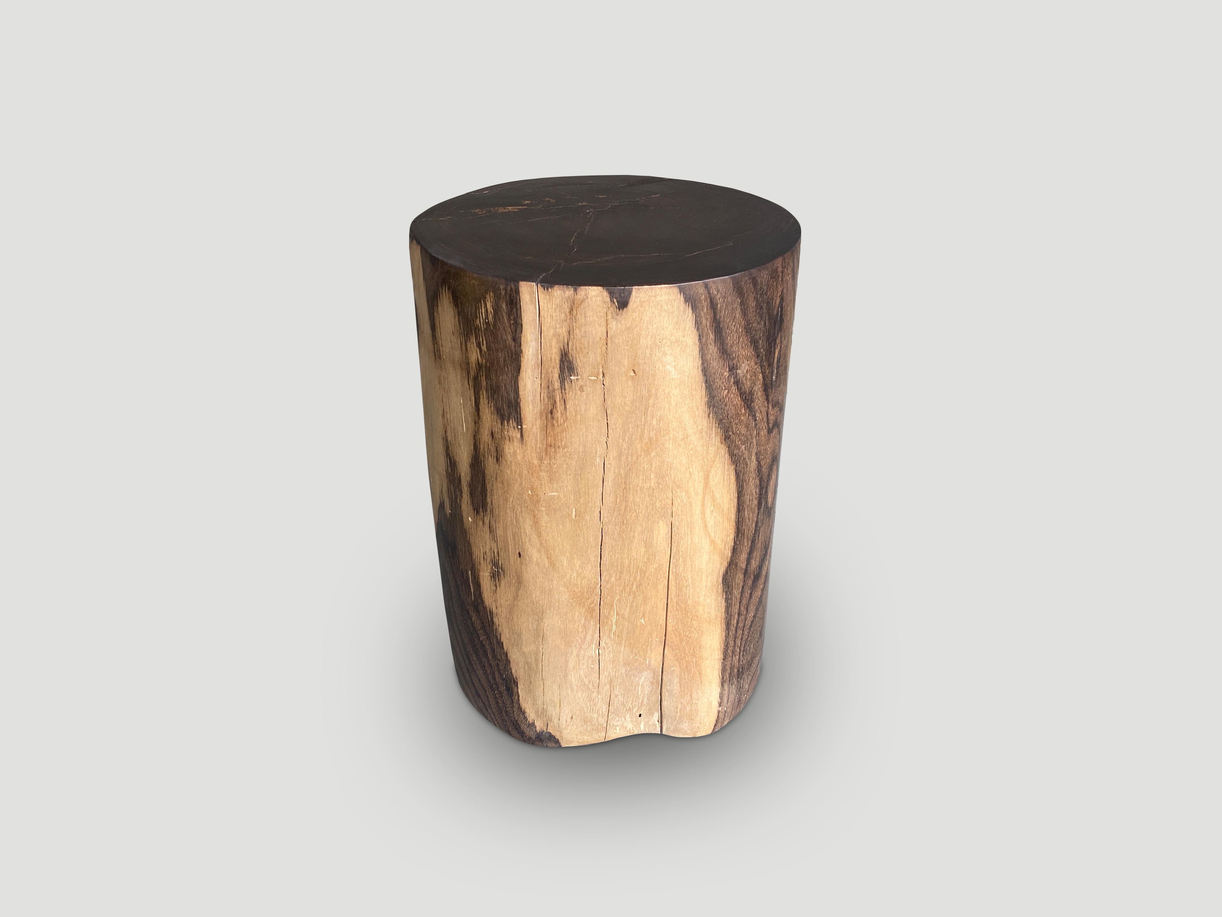 Exquisite rosewood side table with stunning contrasting tones. Finished with a natural oil revealing the beautiful wood grain. We have a collection. The price and images reflect the one shown. 

Own an Andrianna Shamaris original.

Andrianna