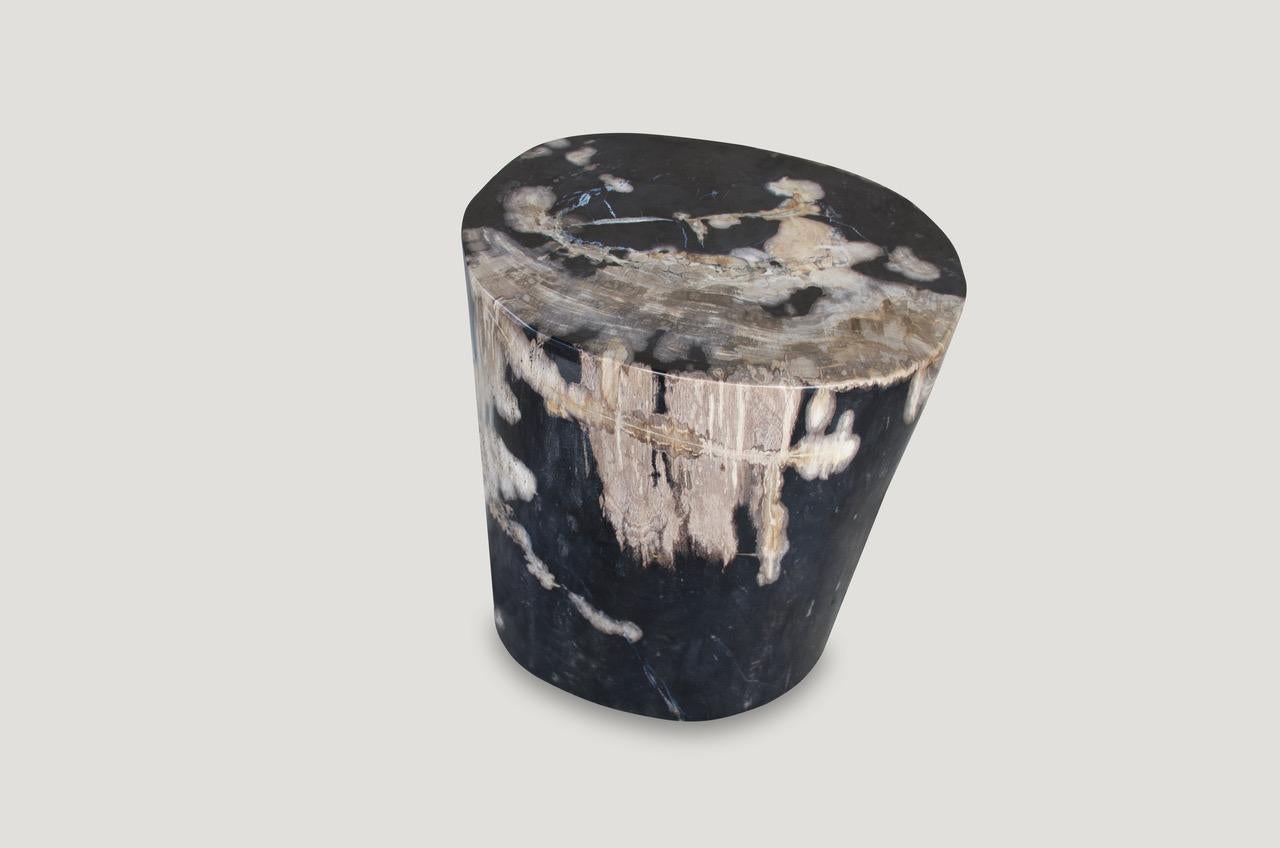 Stunning, contrasting tones on this super smooth, high quality petrified wood side table.

As with a diamond, we polish the highest quality fossilized petrified wood, using our latest ground breaking technology, to reveal its natural beauty and