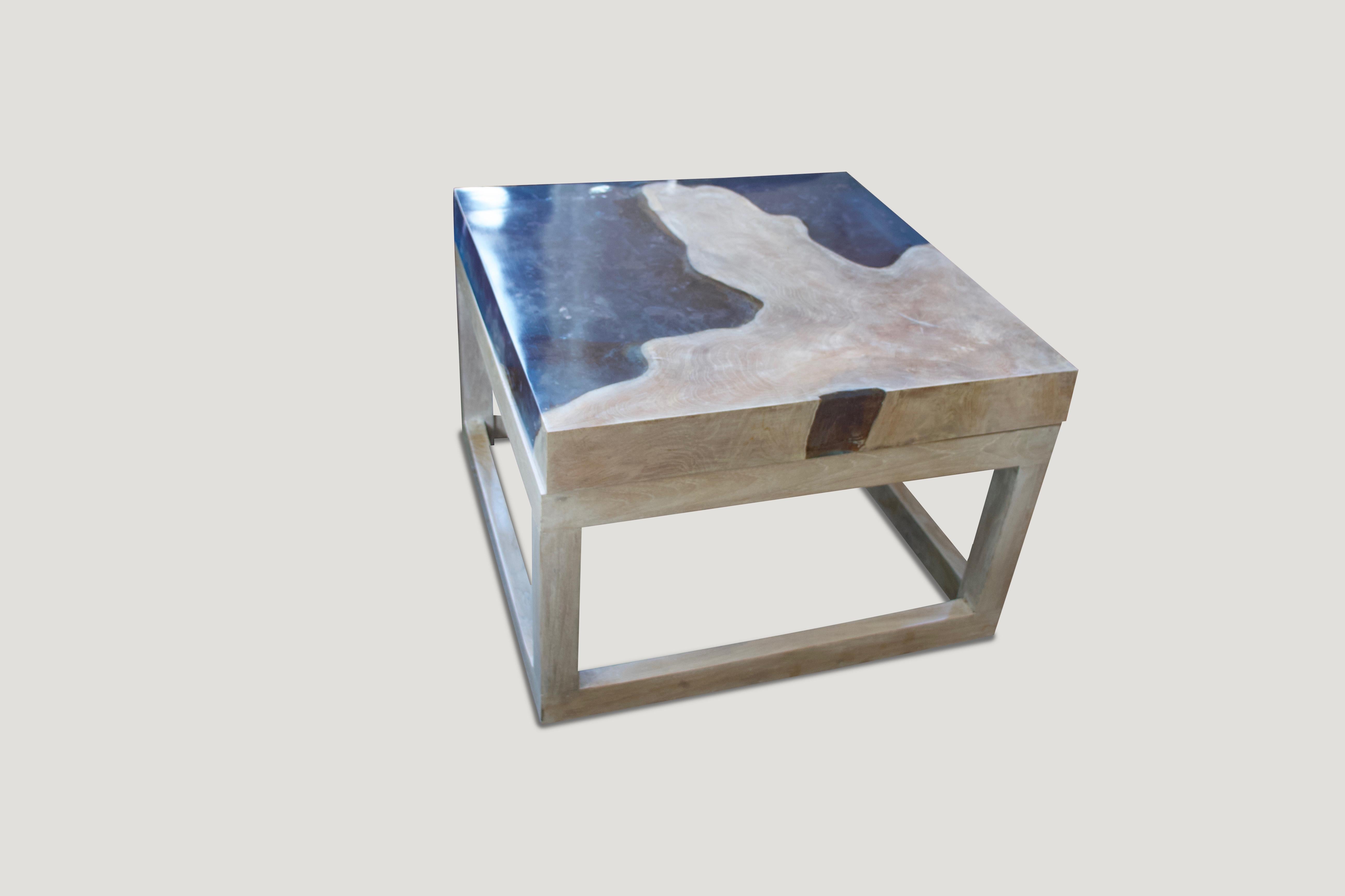 This St. Barts coffee table is made from reclaimed teak infused with ice blue resin, which resembles a unique quartz crystal with many different facets. Straight modern lines with a 3” solid teak and cracked resin top make this an impressive coffee