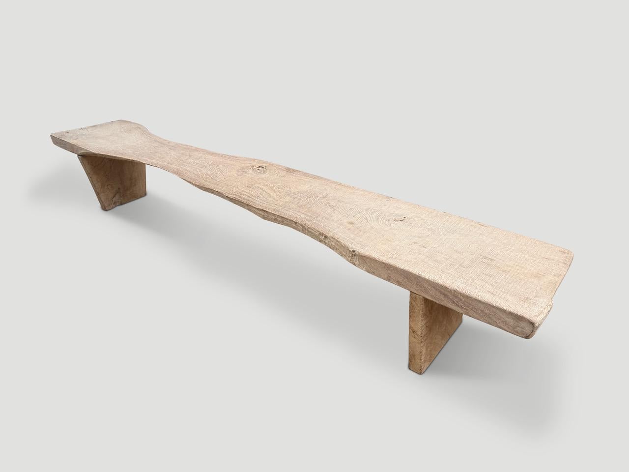 A beautiful three inch thick slab of century old teak wood is turned into a one of a kind bench. We added tapered minimalist legs in contrast to the live edge and butterfly detail to the top. Finished with a wire brush and our secret ingredient