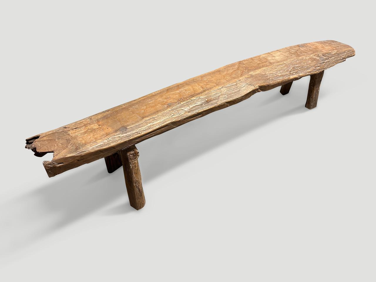 Impressive antique bench with beautiful character and patina, hand made from a single thick teak log. Circa 1950.

This bench was hand made in the spirit of Wabi-Sabi, a Japanese philosophy that beauty can be found in imperfection and impermanence.