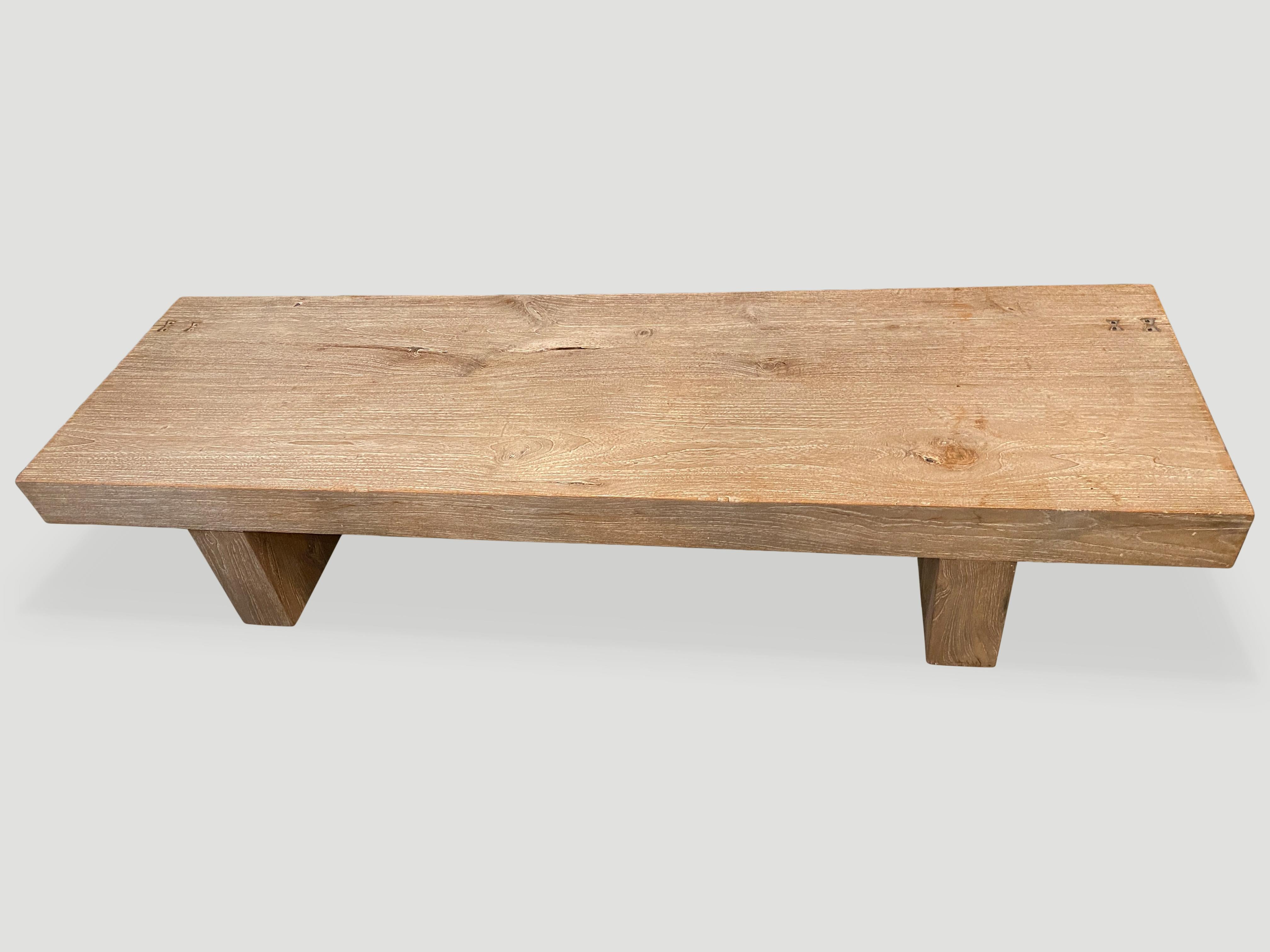 Beautiful reclaimed teak wood coffee table or bench with a light ceruse finish. We added butterfly details into the five inch thick hand carved slabs which are joined together. Shown with minimalist legs.

Own an Andrianna Shamaris