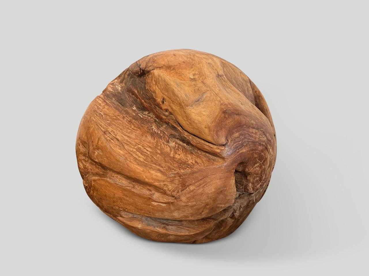 Impressive organic teak root shaped into a one of a kind sculptural sphere. Polished smooth on the outside while the inner sections are left raw. A unique sculpture standing alone or in a group setting. Organic is the new modern.

This sculpture was