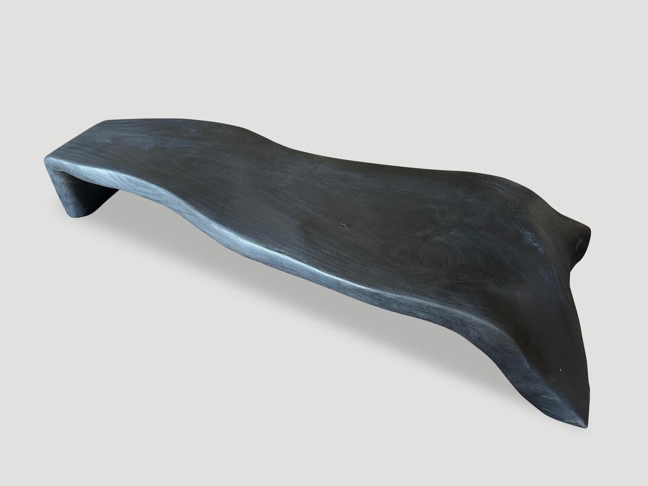 Beautiful minimalist charred bench or coffee table. We added a piece on one end to this seamless long suar wood for stability. Both usable and sculptural. All one of a kind. Please inquire.

The Triple Burnt Collection represents a unique line of