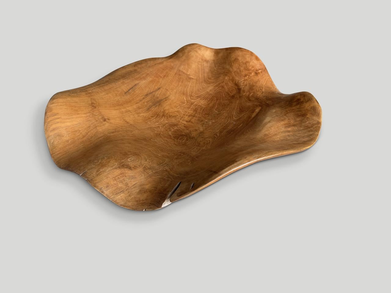 Large amorphous bowl or platter hand made from an impressive century old single piece of teak wood. Both usable and sculptural. Finished with a natural oil revealing the beautiful wood grain. It’s all in the details.

This bowl or platter was hand
