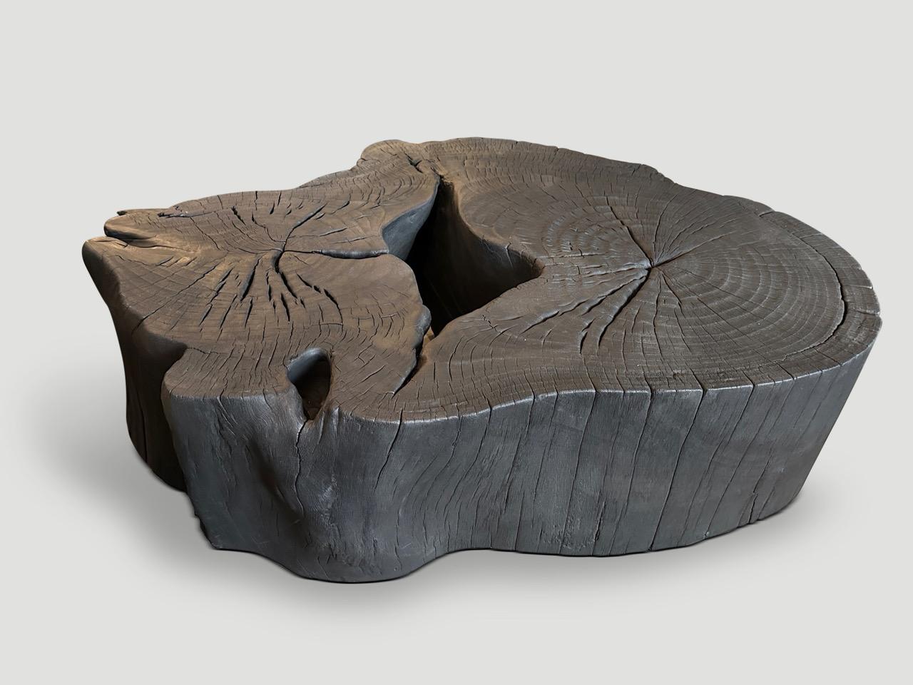 Rare 16” thick reclaimed “kings” wood coffee table, indigenous to Indonesia. This amorphous shape has been charred, sanded and sealed revealing the beautiful wood grain. It’s all in the details.

The Triple Burnt Collection represents a unique line