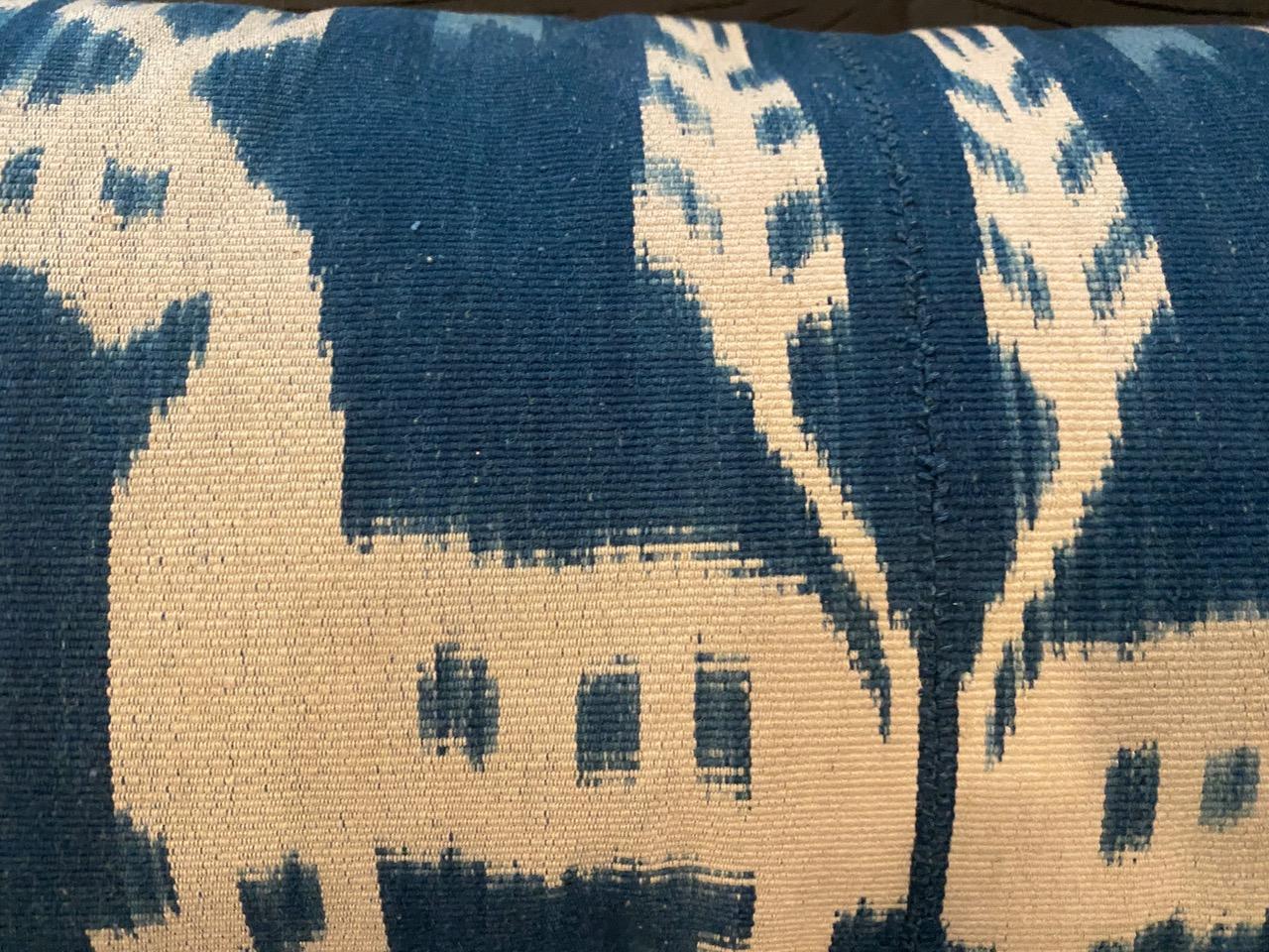 Antique indigo and white textile from Sumba. Ikat is an ancient technique which is used to add patterns to textiles. The designs are created in the yarns rather than on the finished cloth, resulting in both sides patterned with bold contrasting