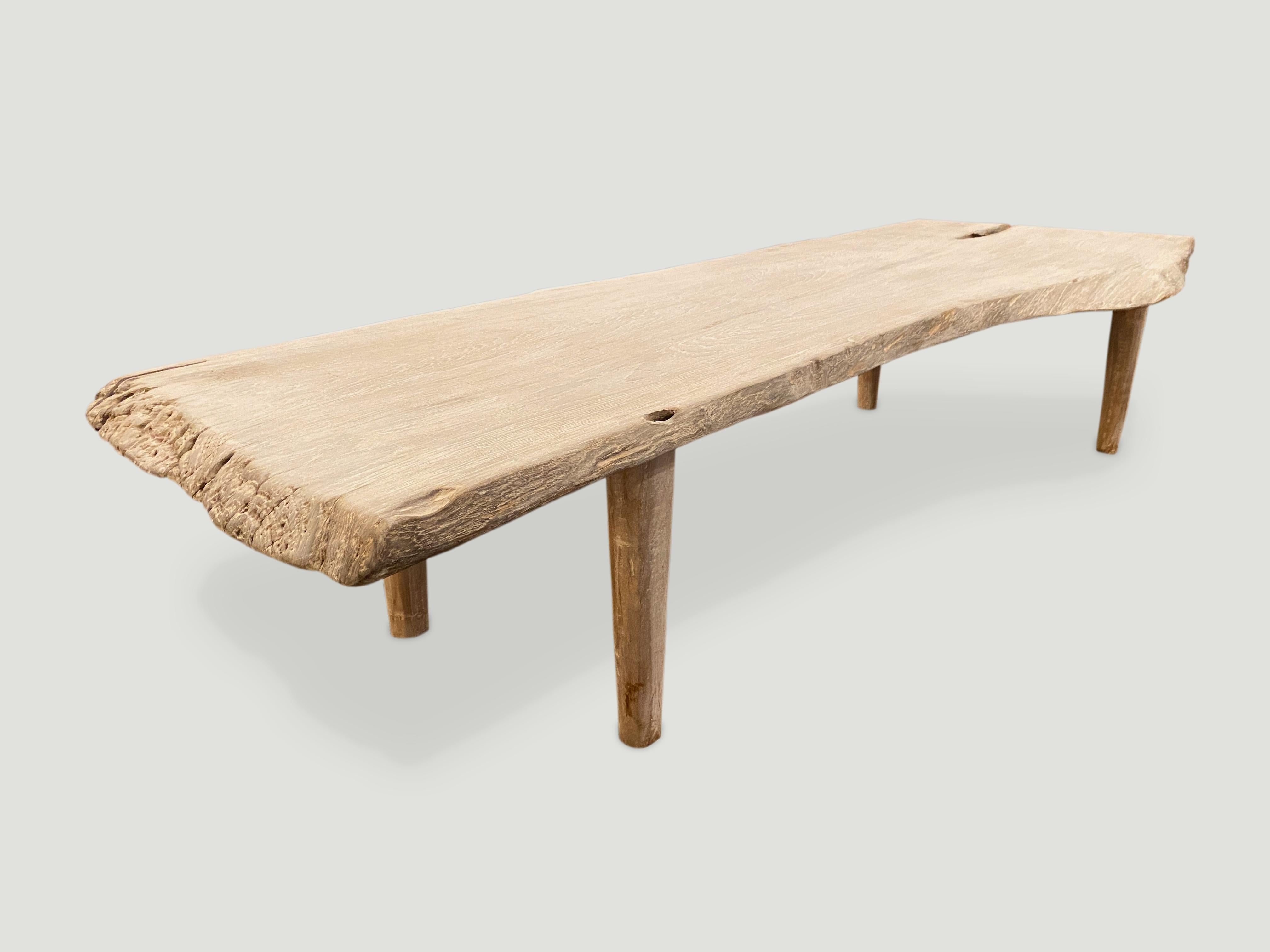 Stunning single slab, live edge teak coffee table or bench. We have added a light white wash finish, still exposing the beautiful grain of this reclaimed teak slab and Minimalist legs. Perfect for inside or outside living. Width extends from 22-30