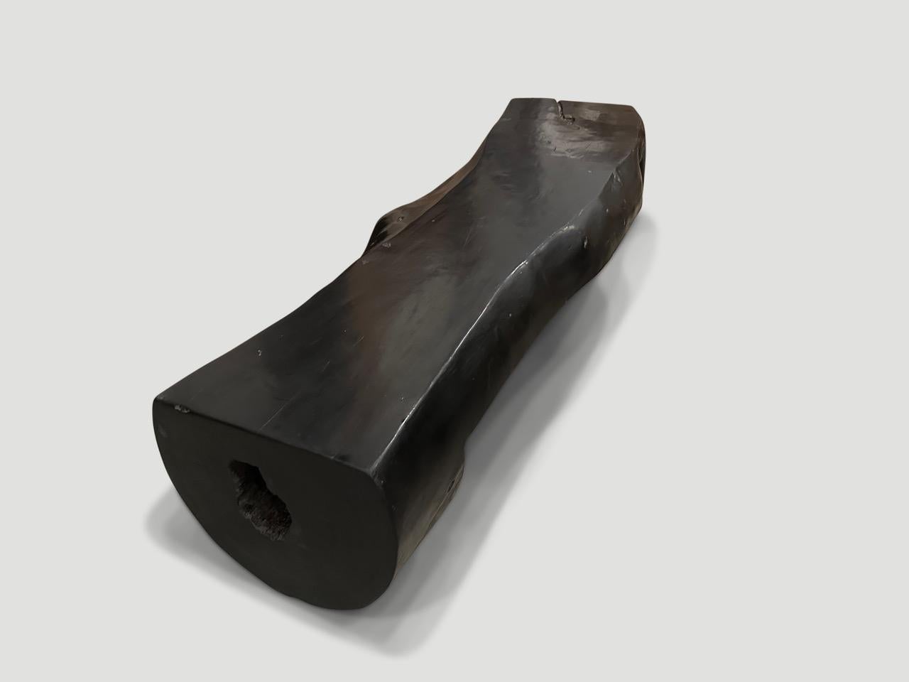 Sculptural log style wood bench. The live edge varies from 24” to 18” wide. Charred, sanded smooth and polished, whilst respecting the natural organic wood. Both functional and sculptural.

The Triple Burnt Collection represents a unique line of