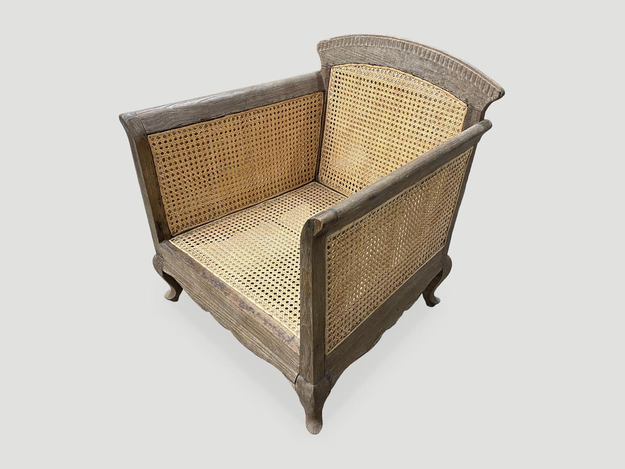 Beautiful antique Colonial chair. Hand-carved feet and restored double-backed hand-woven rattan. A classic chair for any space. Full dimensions; 28