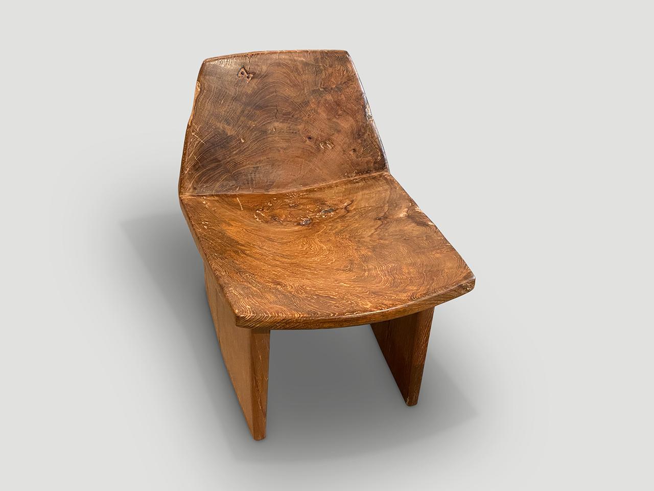 The seat and back rest are hand carved from a single piece of aged teak wood with lovely patina. We added minimalist legs and a tiny wood butterfly inlaid in to the back. It’s all in the details. Full dimensions; 17