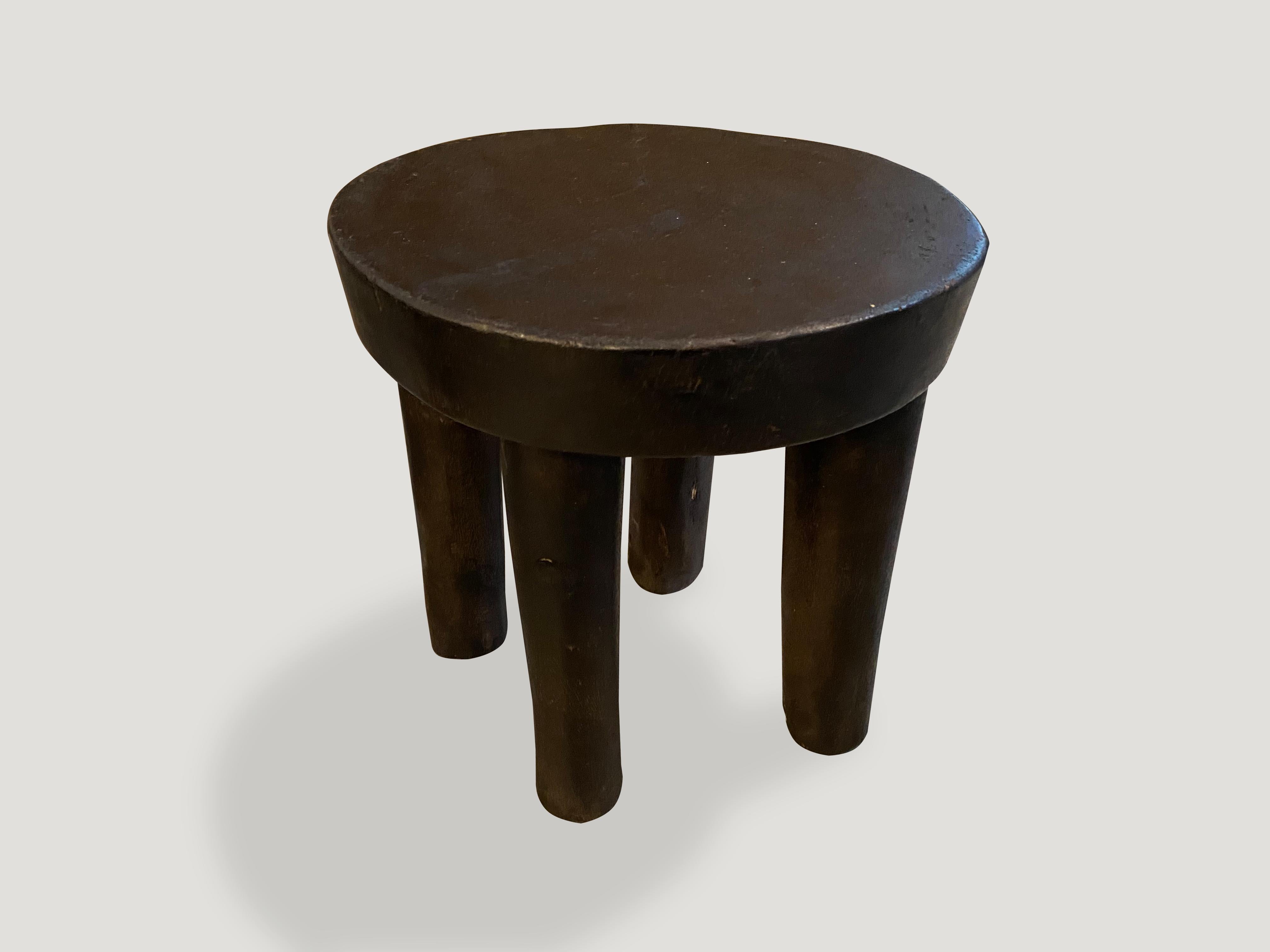 African side table or stool hand carved from a single piece of mahogany wood.

This side table or stool was sourced in the spirit of wabi-sabi, a Japanese philosophy that beauty can be found in imperfection and impermanence. It is a beauty of