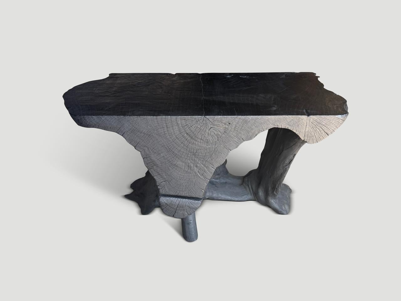 Impressive century old mahogany wood, hand carved into a one of a kind console table both usable and sculptural. Fabulous on both sides. Charred, sanded and sealed revealing the beautiful wood grain. It’s all in the details.

The Triple Burnt