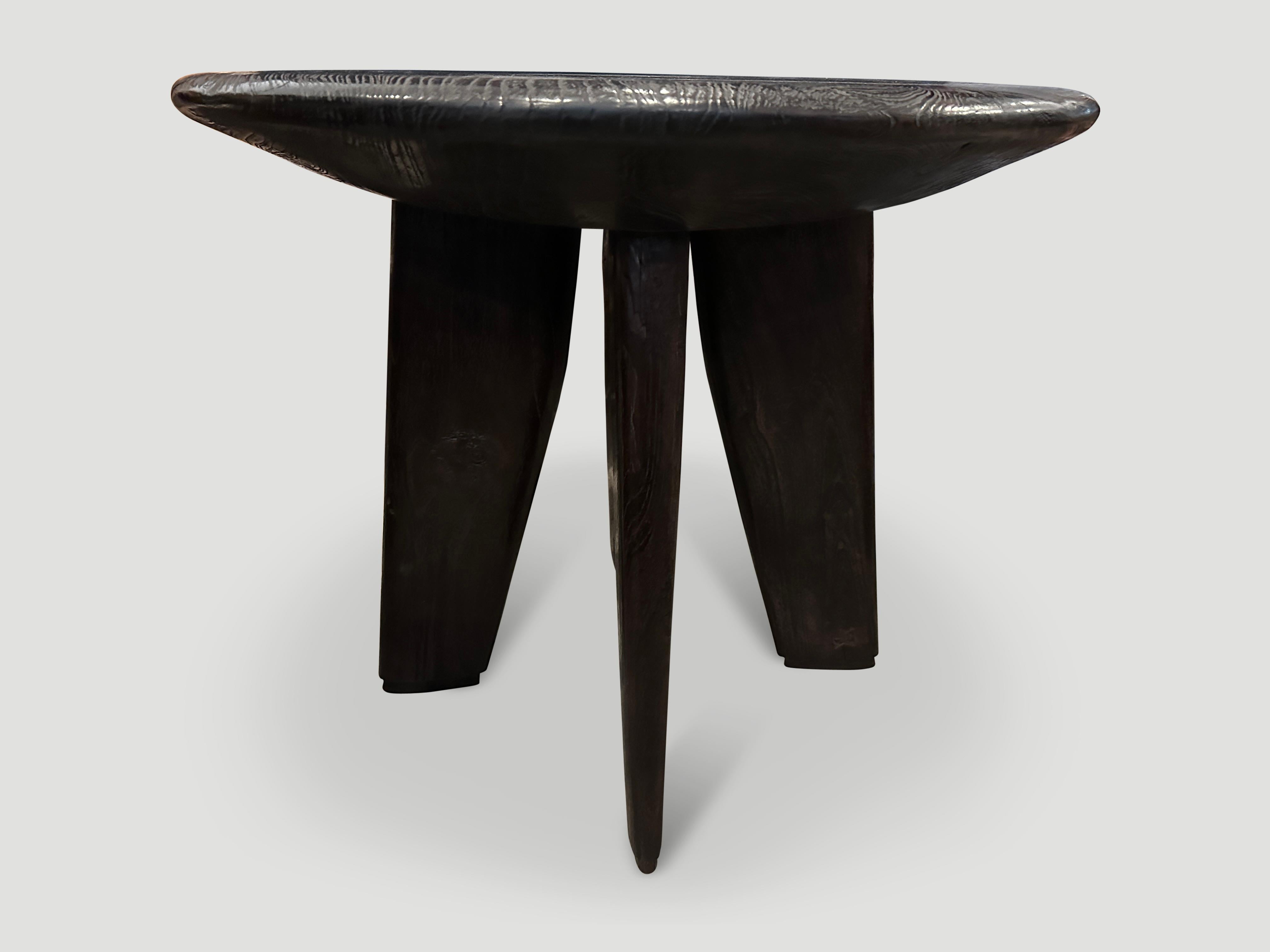 An impressive century old single slab of teak wood taken from my finest collection, is hand carved to produce this beautiful table with a deep six inch bevelled top. We added a butterfly detail to the top and four sculptural minimalist legs.