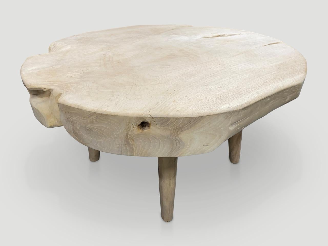 Impressive four inch single slab reclaimed teak wood coffee table. We bleached the teak and added a light white wash revealing the beautiful wood grain. Floating on mid century style legs. Organic with a twist. Also available charred and natural