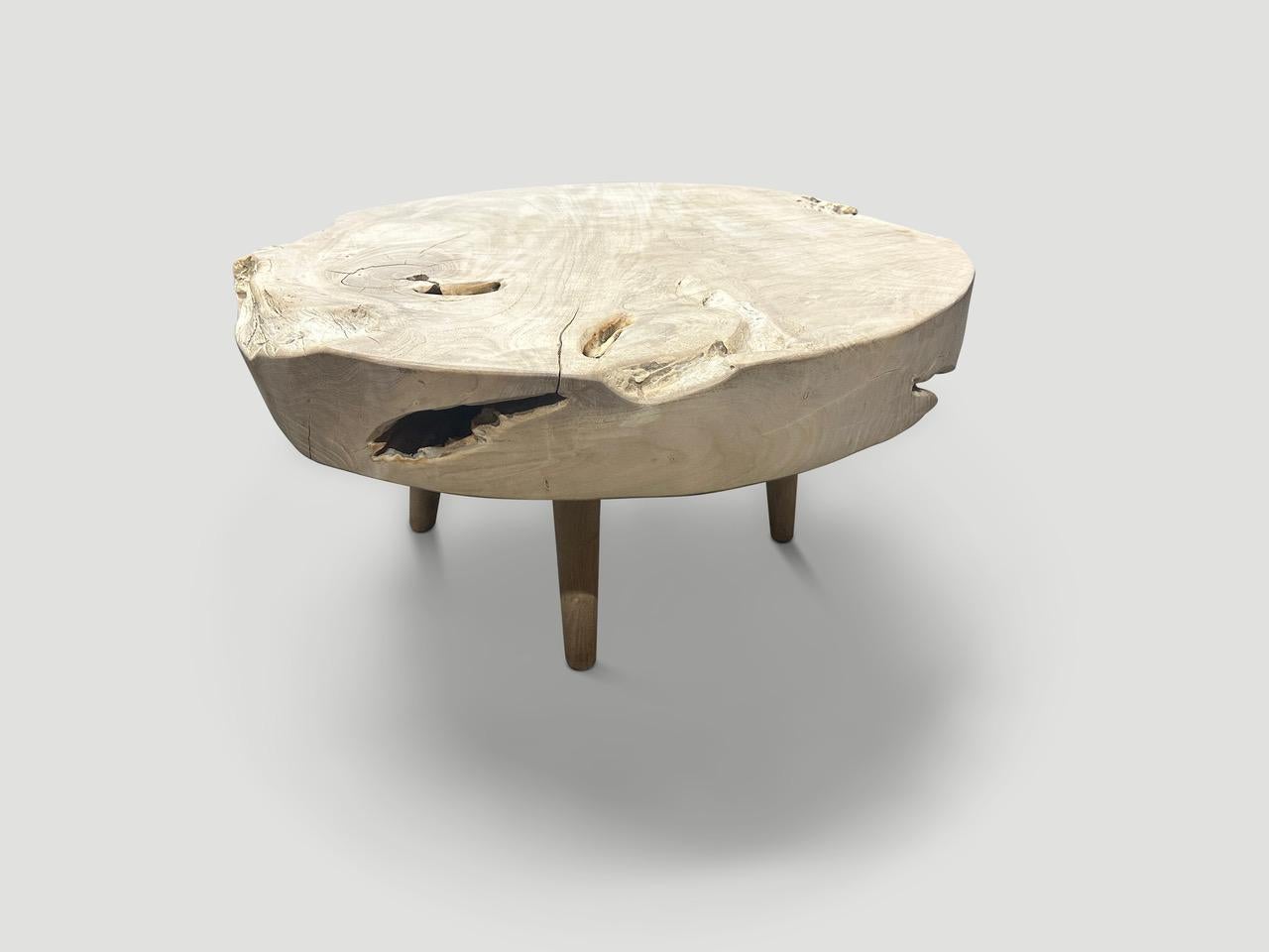 Impressive four inch single slab reclaimed teak wood coffee table. We bleached the teak and added a light white wash revealing the beautiful wood grain. Floating on mid century style legs. Organic with a twist. It’s all in the details. We have a
