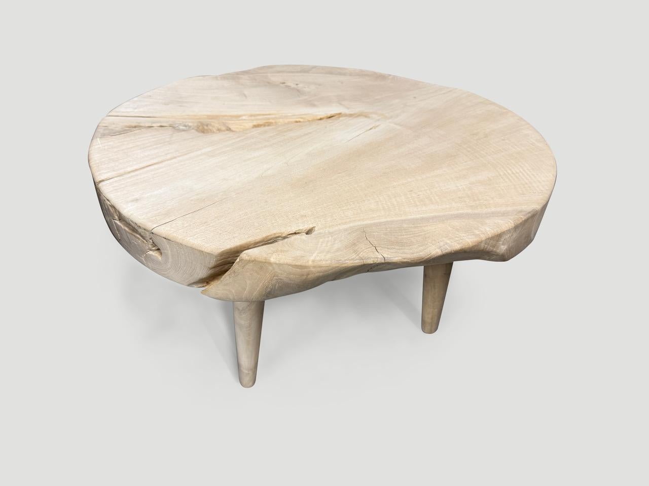 Impressive three inch single slab reclaimed teak wood coffee table. We bleached the teak and added a light white wash revealing the beautiful wood grain. Floating on mid century style legs. Organic with a twist. It’s all in the details. We have a