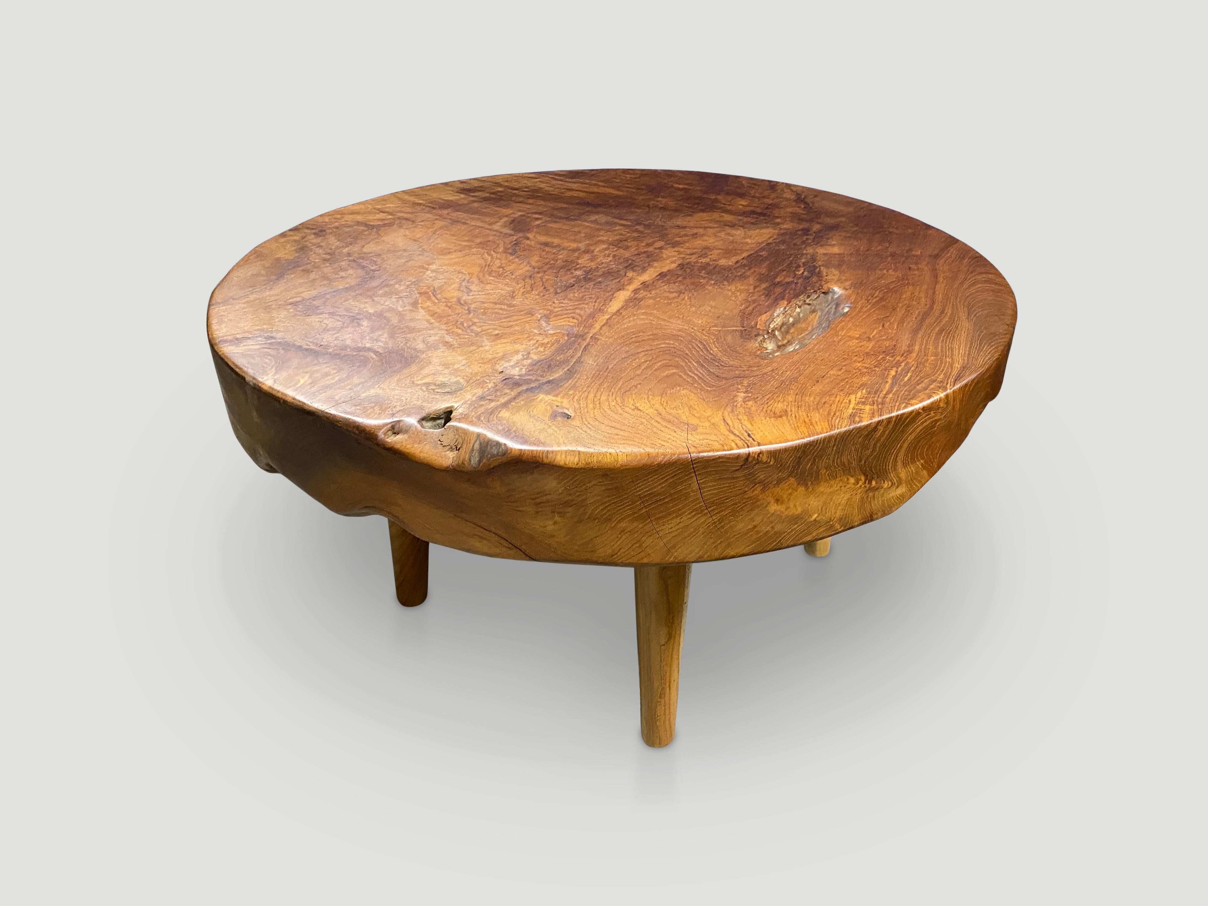 Impressive three and a half inch reclaimed teak wood single slab coffee table. Floating on mid century style cone legs and finished with a natural oil revealing the beautiful wood grain. Organic with a twist. Also available bleached and
