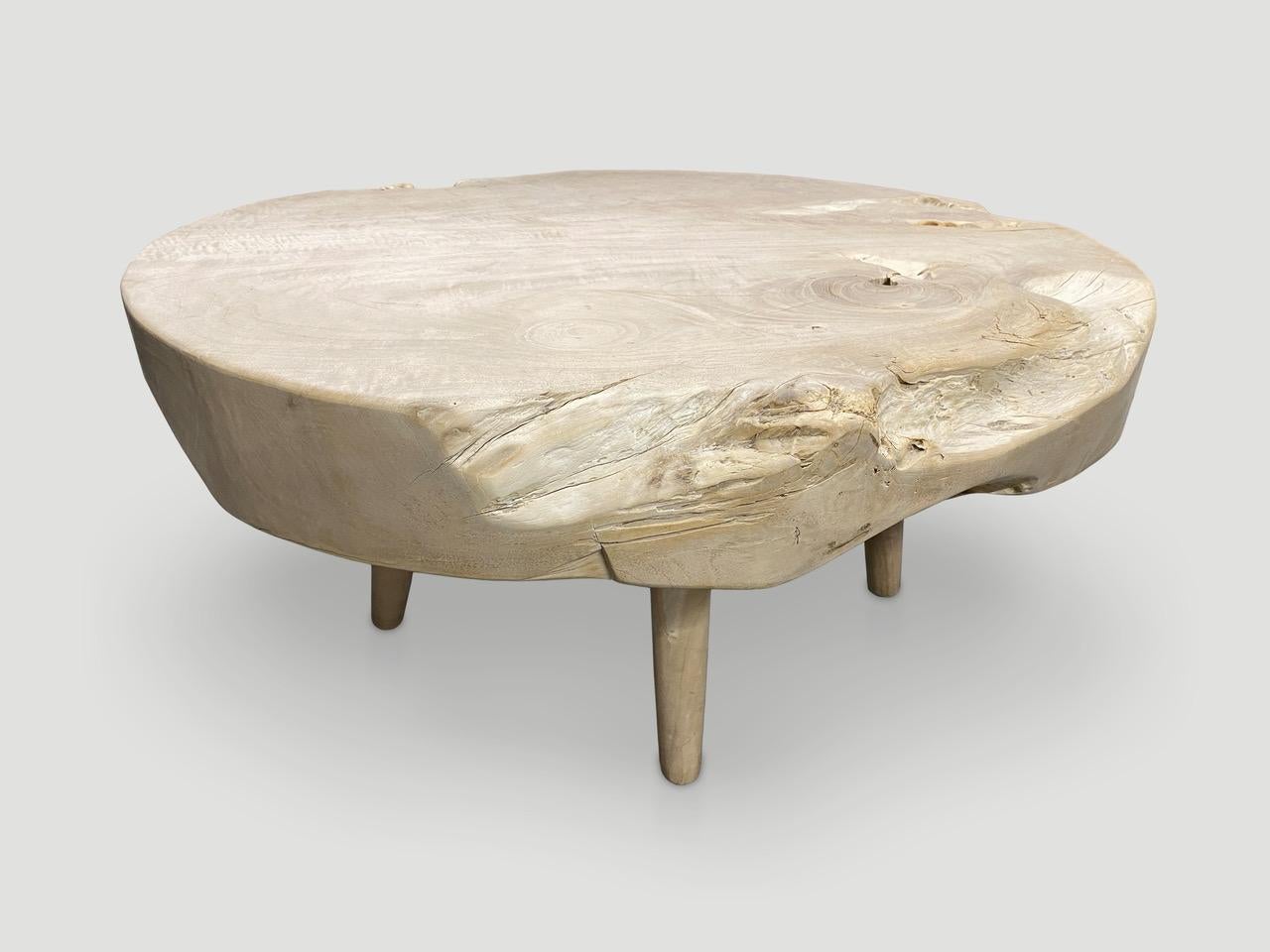 Impressive four and a half inch single slab reclaimed teak wood coffee table. We bleached the teak and added a light white wash revealing the beautiful wood grain. Floating on mid century style legs. Organic with a twist. Also available charred and