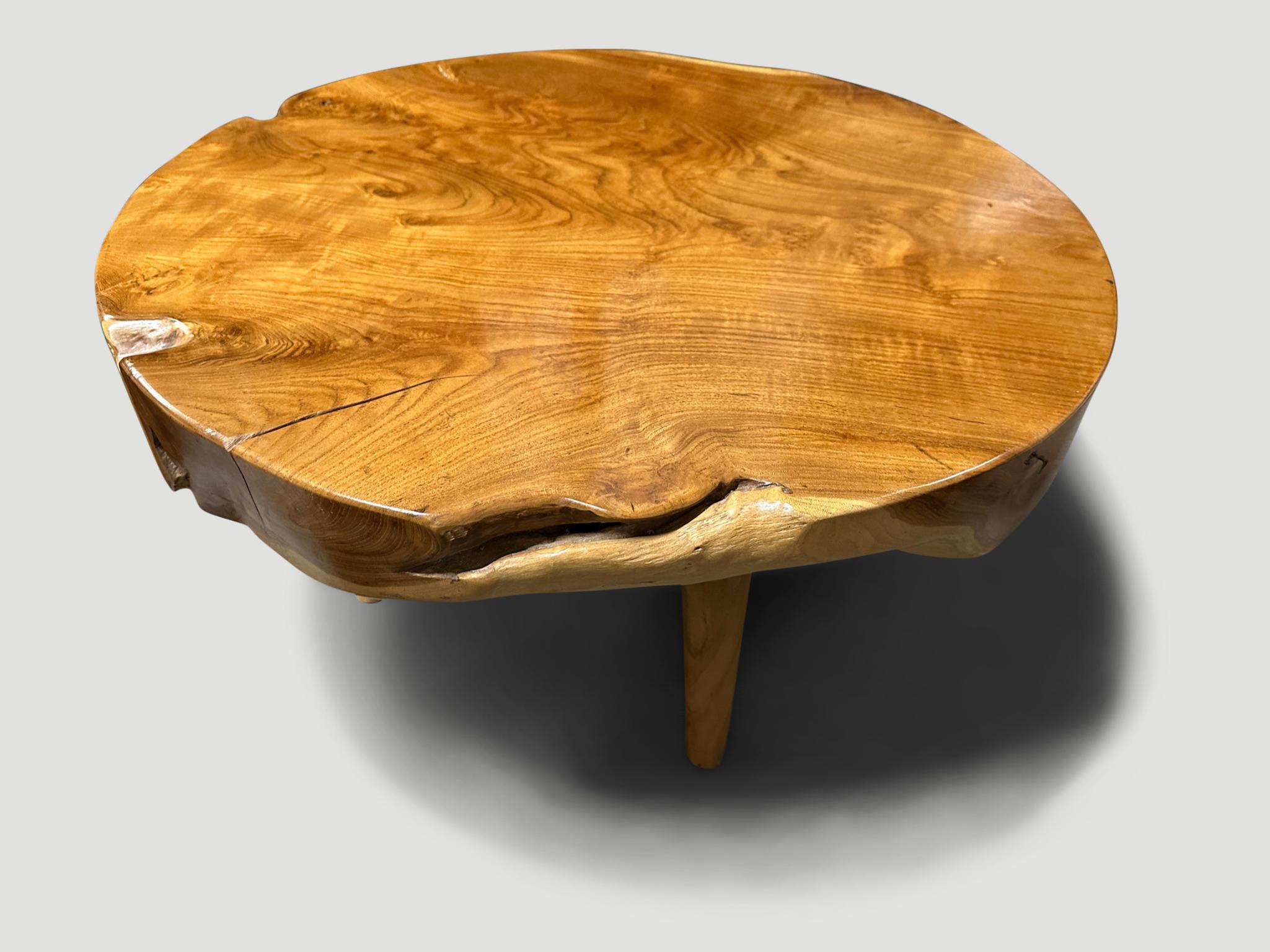 Impressive four inch reclaimed teak wood single slab coffee table. Floating on mid century style cone legs and finished with a natural oil revealing the beautiful wood grain. It’s all in the details. 

Own an Andrianna Shamaris original.

Andrianna