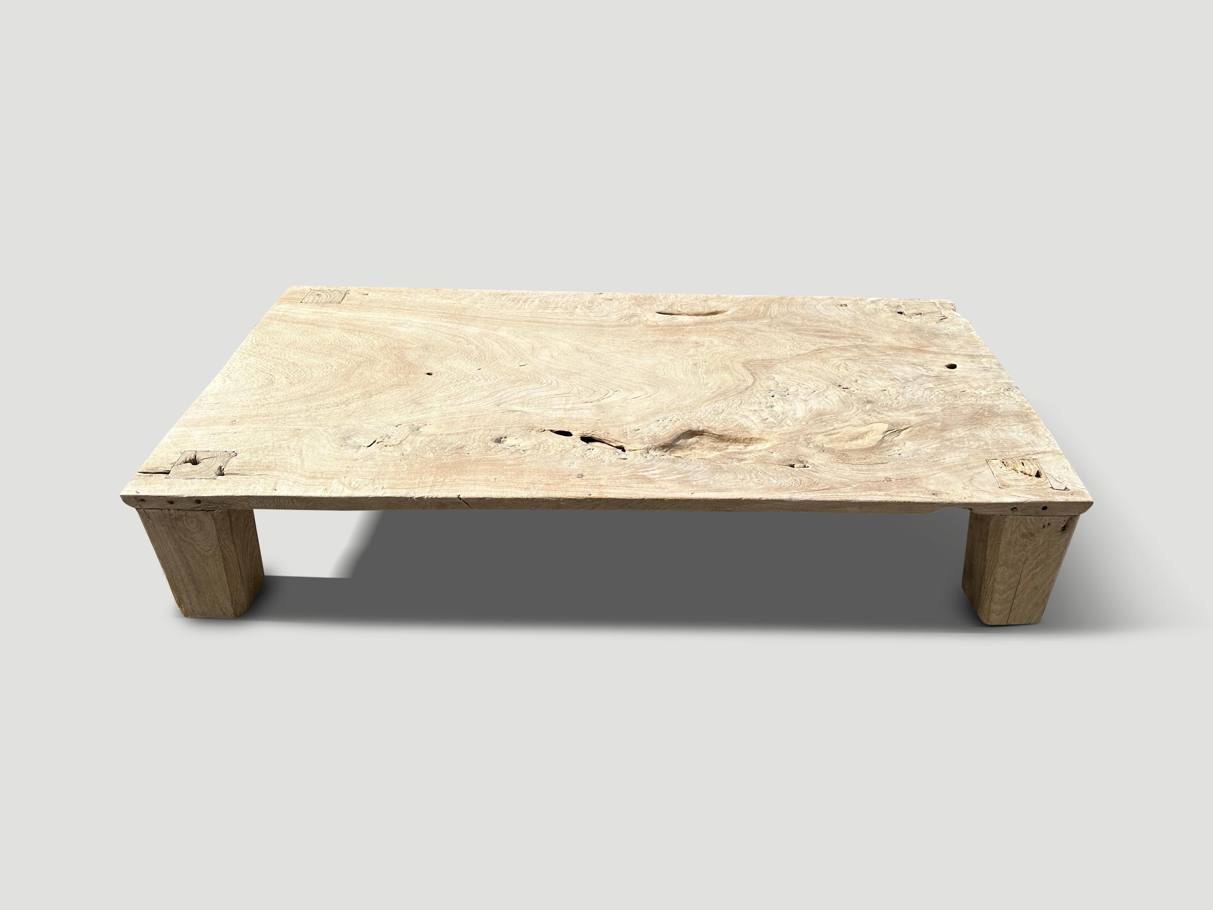 Single teak wood panel with beautiful detail. We added block style legs to this minimalist coffee table and a light white wash revealing the stunning wood grain. It’s all in the details.

The St. Barts Collection features an exciting line of organic