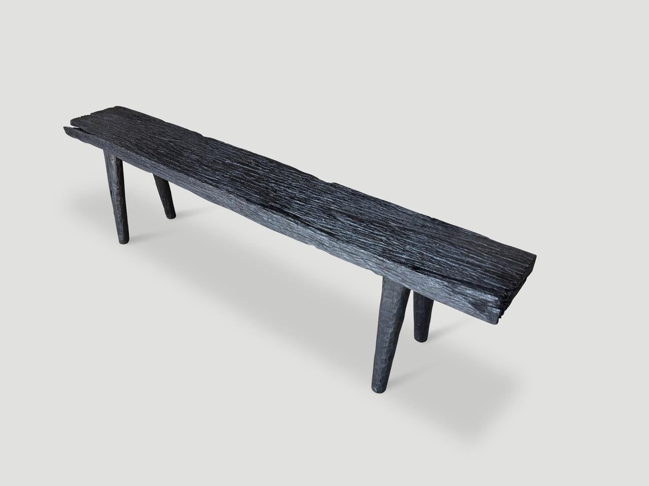 Beautiful minimalist iron wood bench, also known as ulin wood. The top is an impressive two inch thick slab supported by smooth teak legs. Charred sanded and sealed revealing the unique wood grain. It’s all in the details.

The Triple Burnt