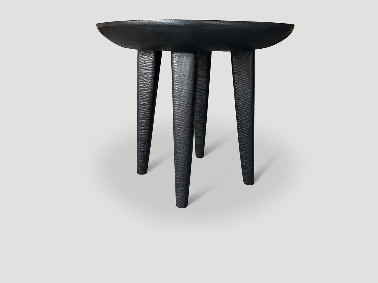 Minimalist side table with a three inch single slab bevelled top resting on cone style legs. Charred, sanded and sealed revealing the beautiful wood grain on the legs and the top. It’s all in the details. Pair available. The price reflects one.

The