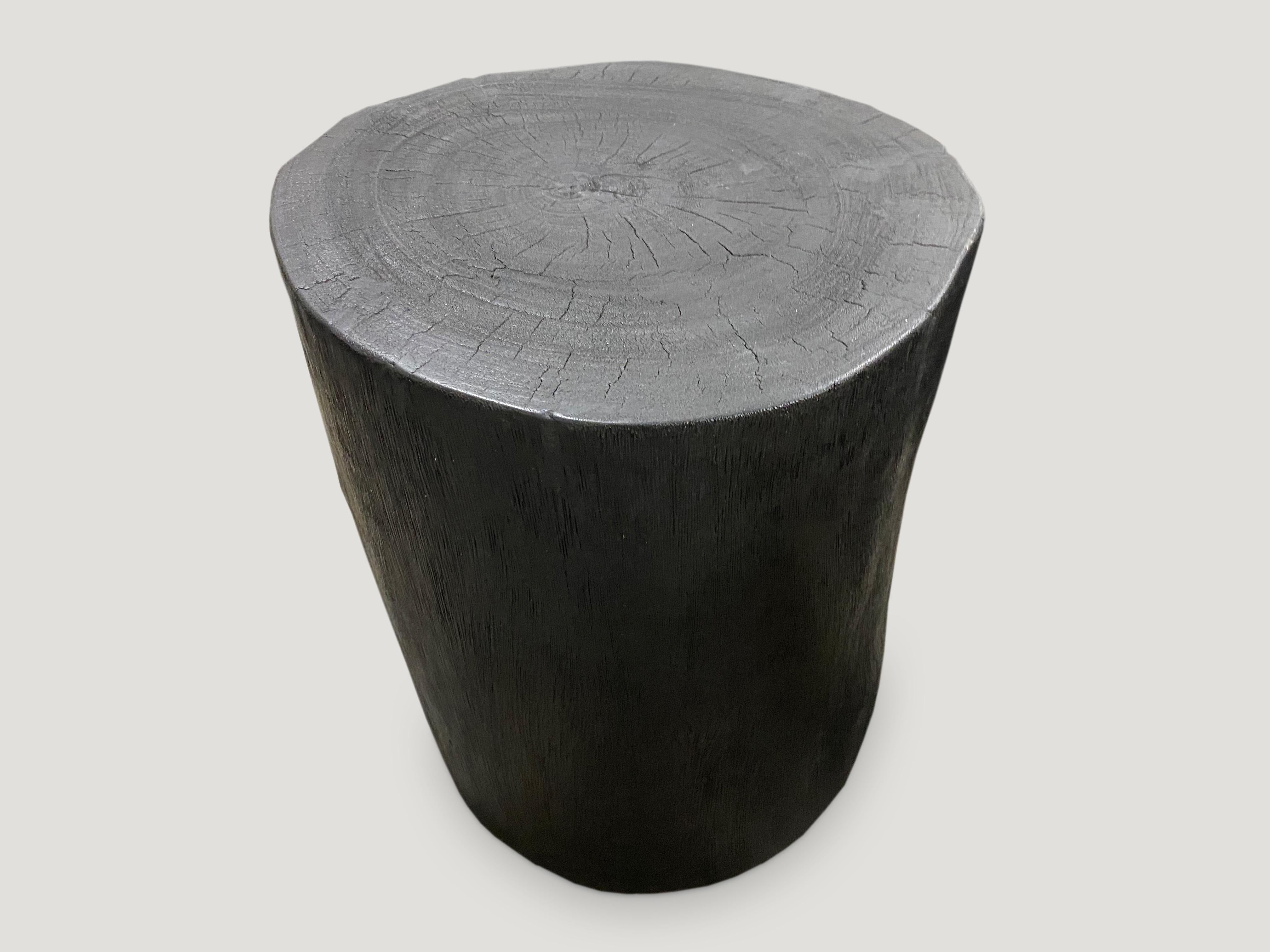 Minimalist hand carved reclaimed suar wood side table. Burnt, sanded and sealed whilst respecting the natural organic shape. We have a collection. The price and size reflect the one shown. All unique.

The Triple Burnt collection represents a