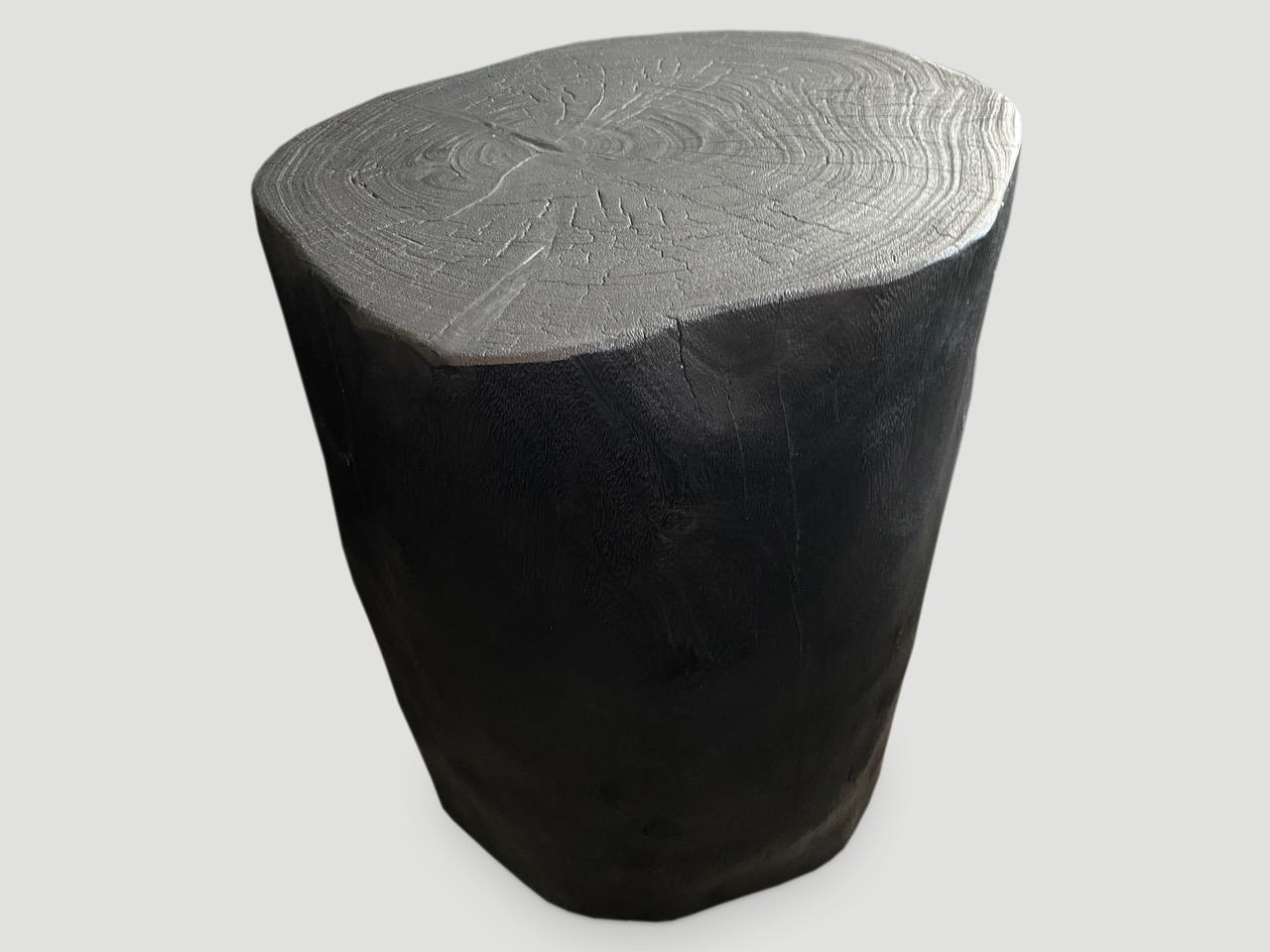 Minimalist hand carved reclaimed suar wood side table. Burnt, sanded and sealed whilst respecting the natural organic shape. We have a collection. The price and size reflect the one shown. All unique.

The Triple Burnt Collection represents a