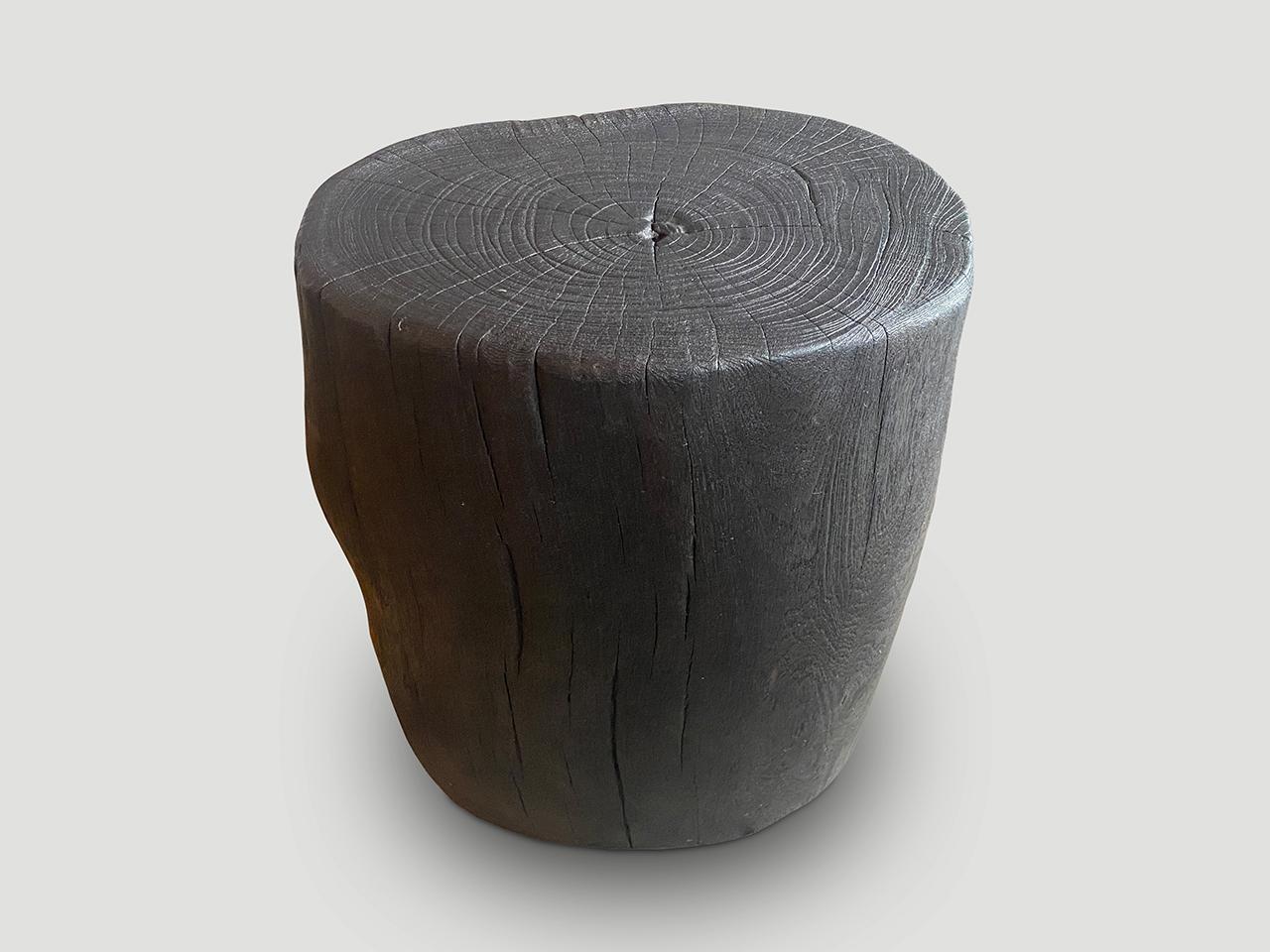 Minimalist hand carved reclaimed suar wood side table. Charred sanded and sealed whilst respecting the natural organic shape. Finished with a natural oil revealing the beautiful wood grain.

The Triple Burnt Collection represents a unique line of