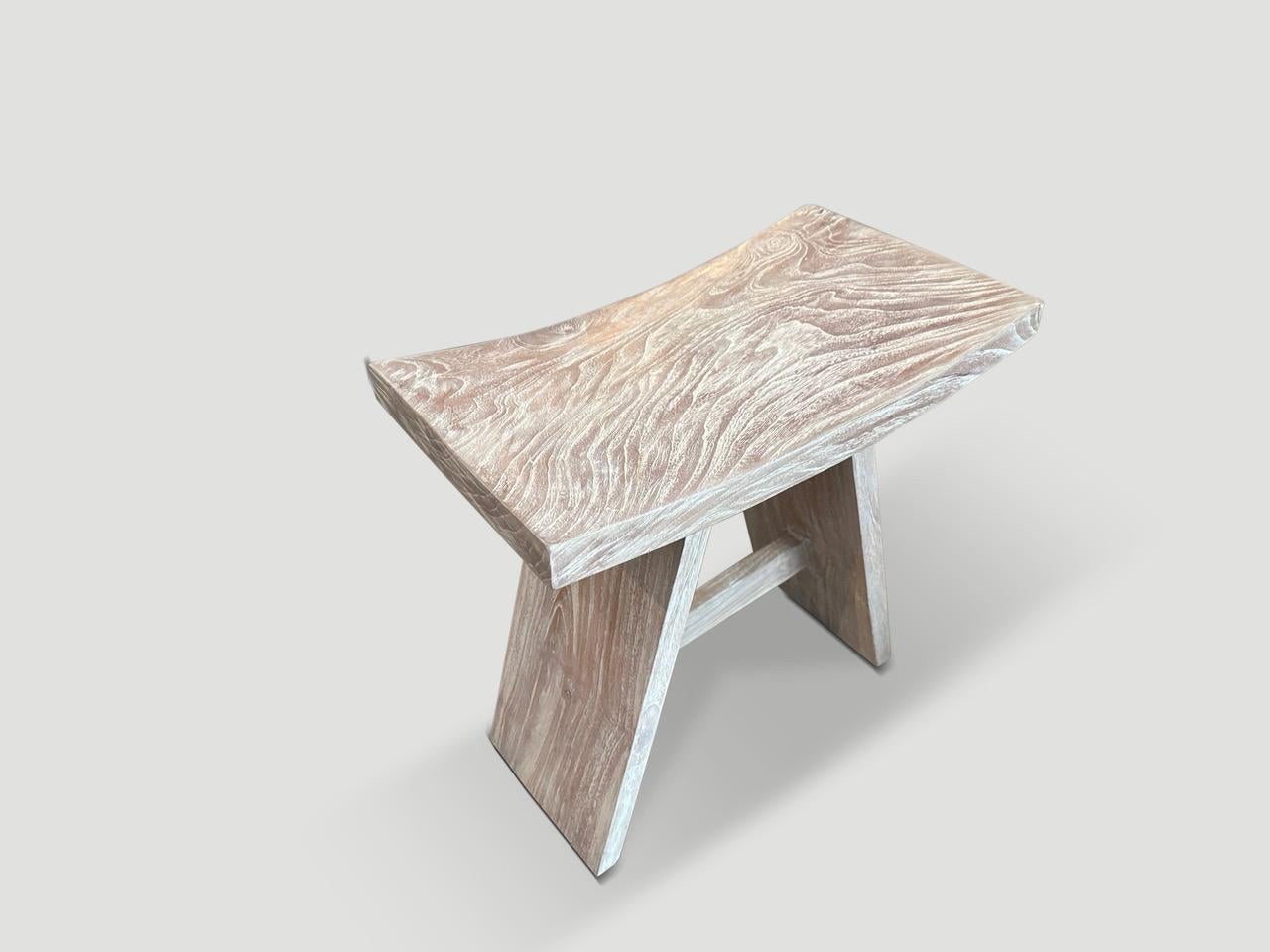 Sleek minimalist bench or stool hand made from a single slab of reclaimed teak with a cerused finish revealing the beautiful wood grain. We have a collection. The images reflect the one shown.

The St. Barts Collection features an exciting line of