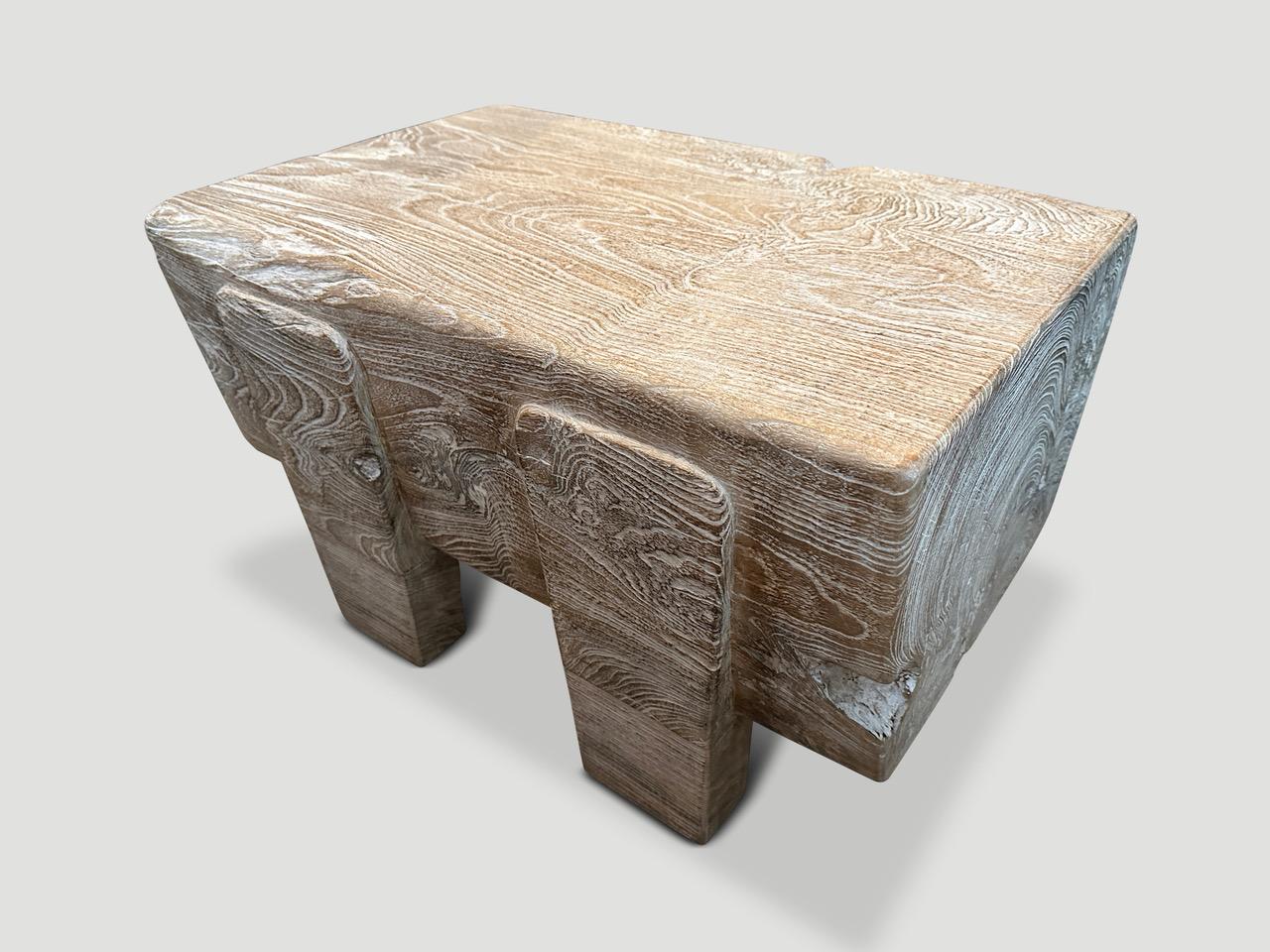 An impressive ten inch thick log floats 5.5” off the floor on minimalist cut out legs. We added a cerused finish revealing the beautiful wood grain. This one of a kind piece can be used as a small coffee table, side table or bench. A butterfly is