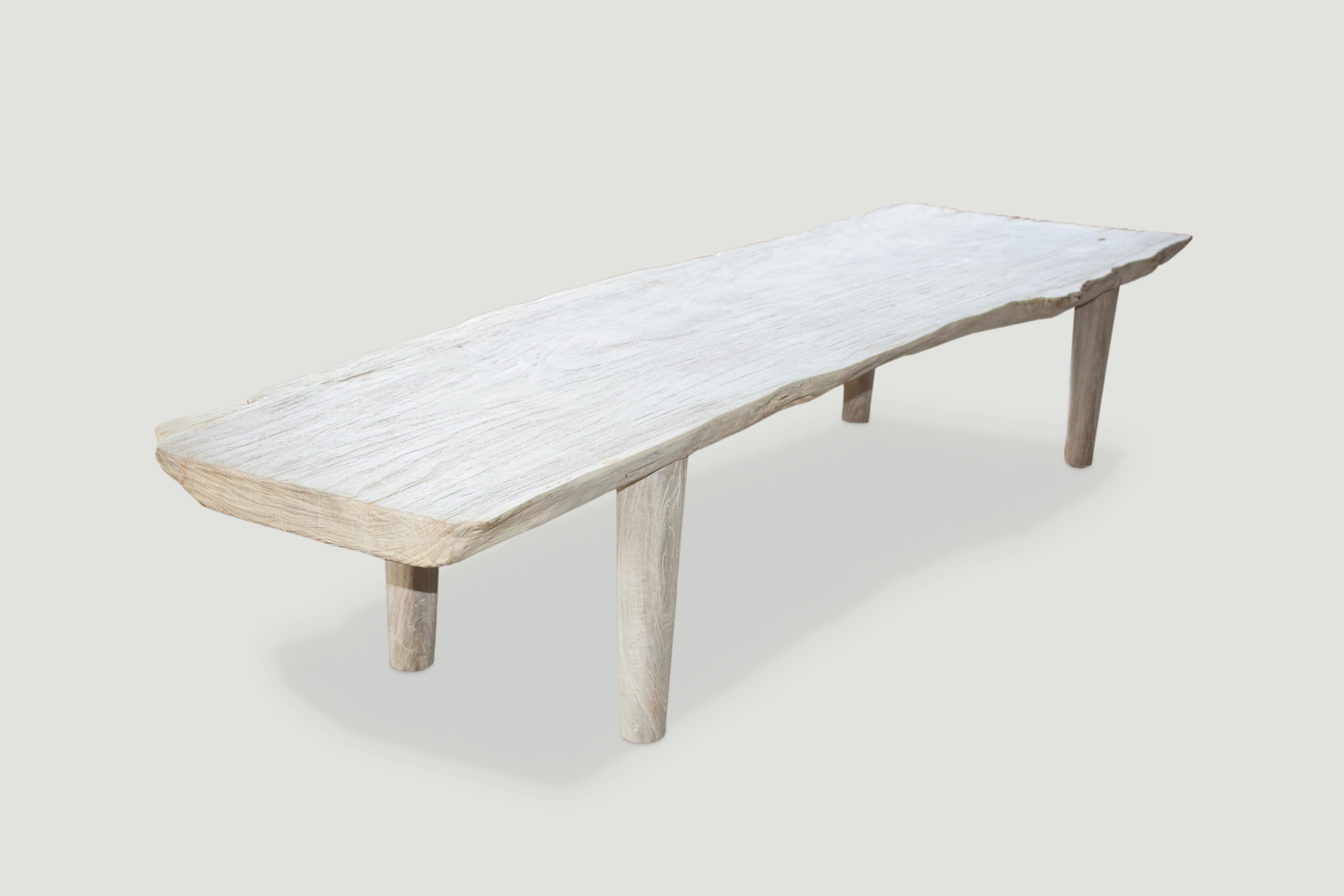 Impressive single slab, live edge teak coffee table or bench with natural erosion on one end. We have added a light white wash finish, allowing the beautiful grain of this reclaimed teak slab to be exposed plus added Minimalist legs. Perfect for