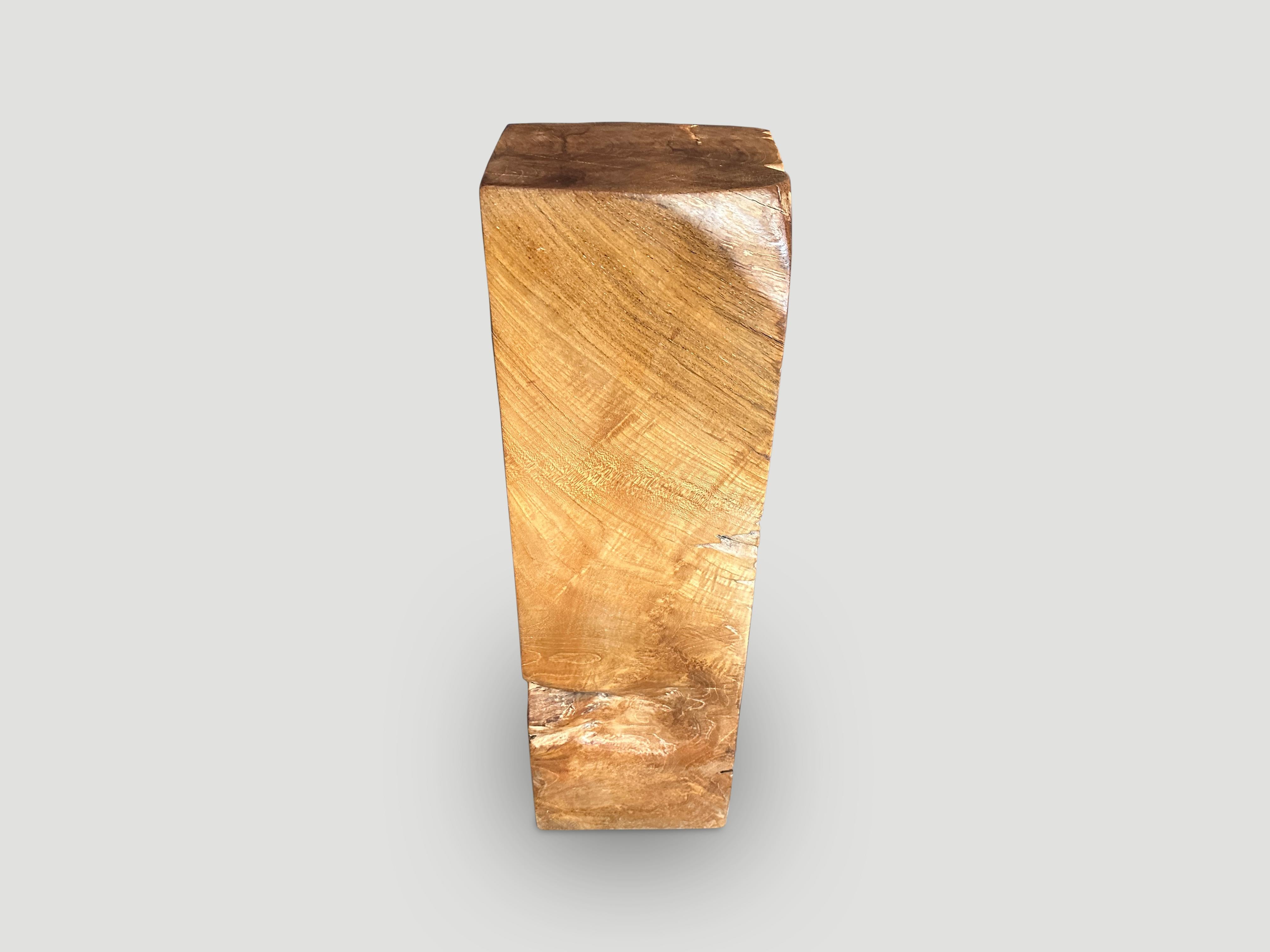 Reclaimed teak wood pedestal or side table hand carved into this usable shape whilst respecting the organic wood. Polished with a natural oil revealing the beautiful wood grain and textures. Both usable and sculptural.

This side table or pedestal