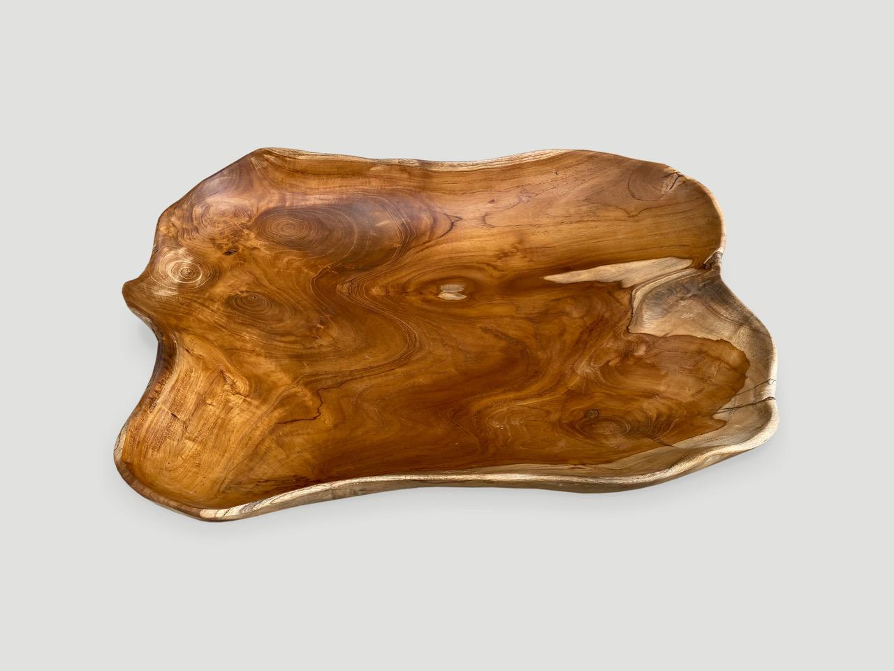 Beautiful grain on this Minimalist teak bowl, hand carved from a single piece of reclaimed natural teak wood.

This bowl or tray was sourced in the spirit of wabi-sabi, a Japanese philosophy that beauty can be found in imperfection and