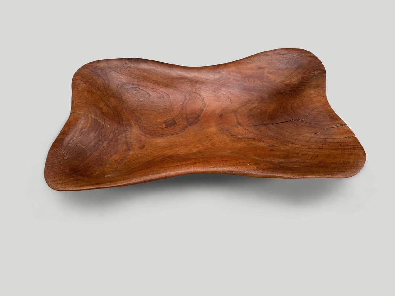 Minimalist teak platter or bowl hand carved from a single piece of reclaimed teak wood. Finished with a natural oil revealing the beautiful wood grain.

This bowl or platter was sourced in the spirit of wabi-sabi, a Japanese philosophy that beauty