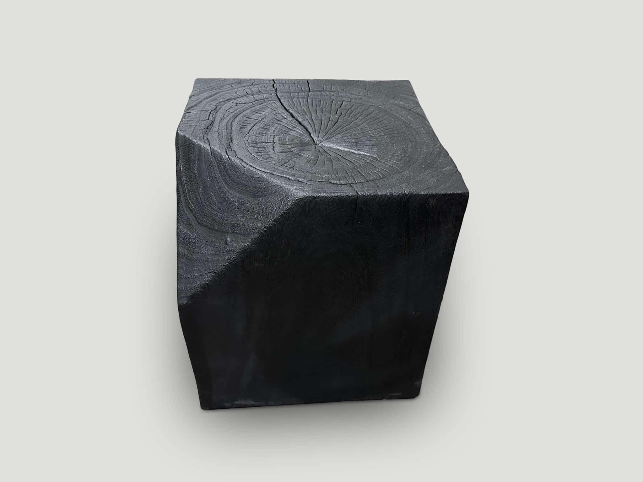 Modular faceted reclaimed suar wood side table. Charred, sanded and sealed revealing the beautiful wood grain. We have a collection that can be placed together for different shapes and sizes. The price reflects the one shown.

The Triple Burnt