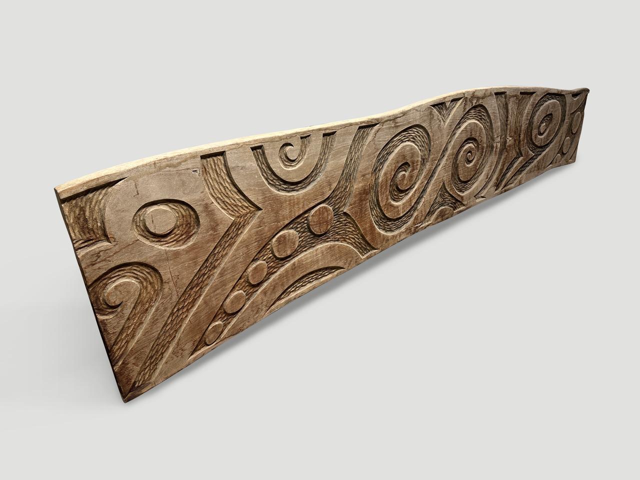 We added an abstract carving to this impressive ancient teak wood panel. Fabulous as a head board, art piece or architectural element. A collaboration with the old and the new. Full dimensions ; 118