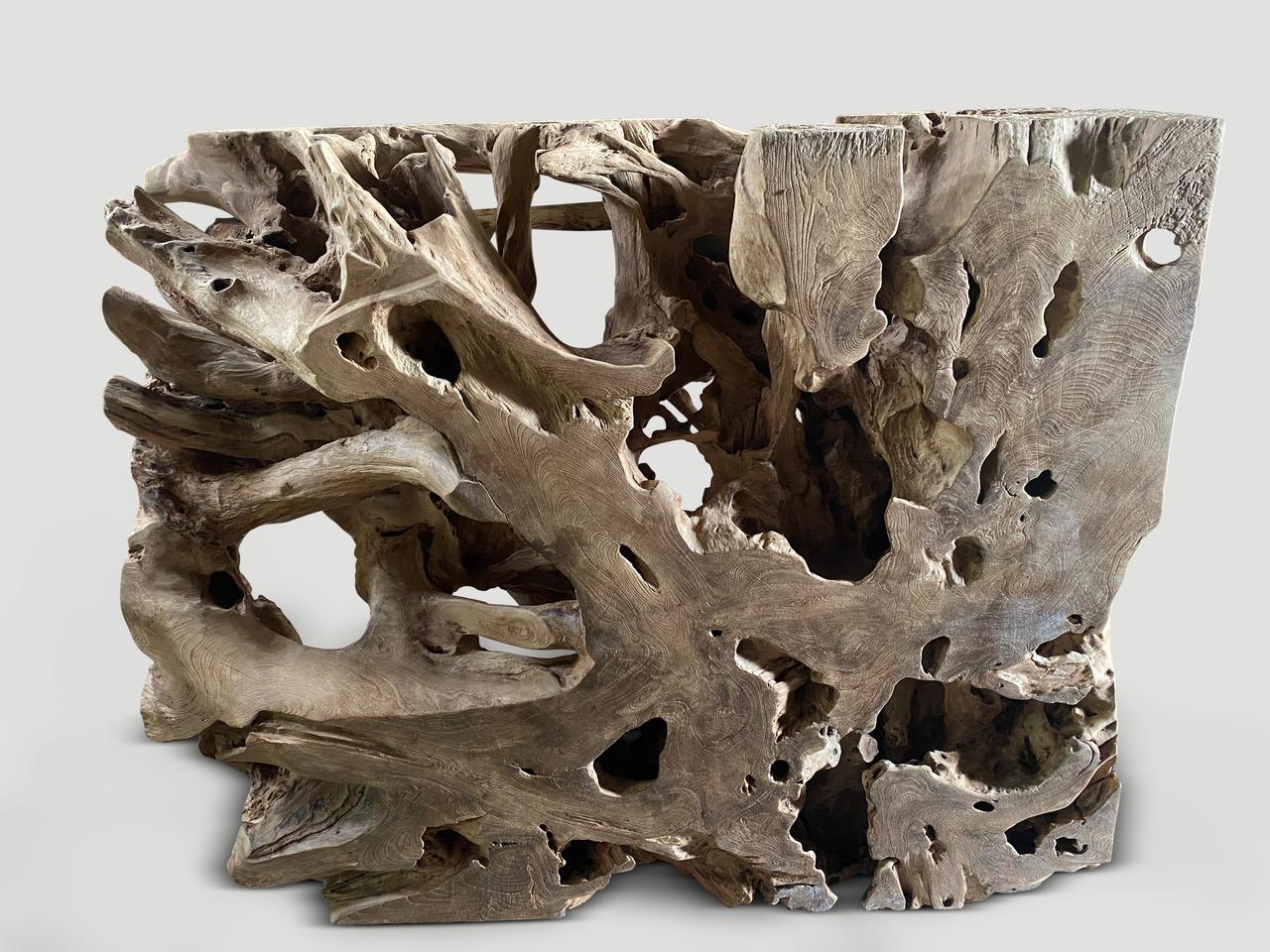 Impressive 100 year old teak root, hand carved and shaped into this one of a kind rare sculptural piece of art, console or room divider. Beautiful on both sides, this versatile piece can be shown either way with each side unique. Finished with a