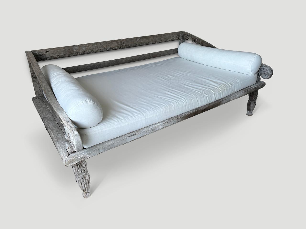 Rare antique teak day bed from the island of Madura. The patina on the wood is stunning. Circa 1900. The length of the arm is 48.5 and hand carved from one piece of wood. Taken from my finest collection and impossible to source now. For the