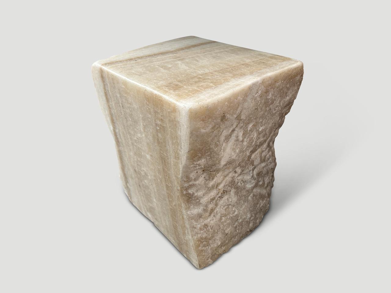Beautiful pale onyx side table with unique textures and tones. Both usable and sculptural. It’s fascinating how Mother Nature produces these stunning five thousand year old logs with such contrasting colors and natural patterns throughout. Modern