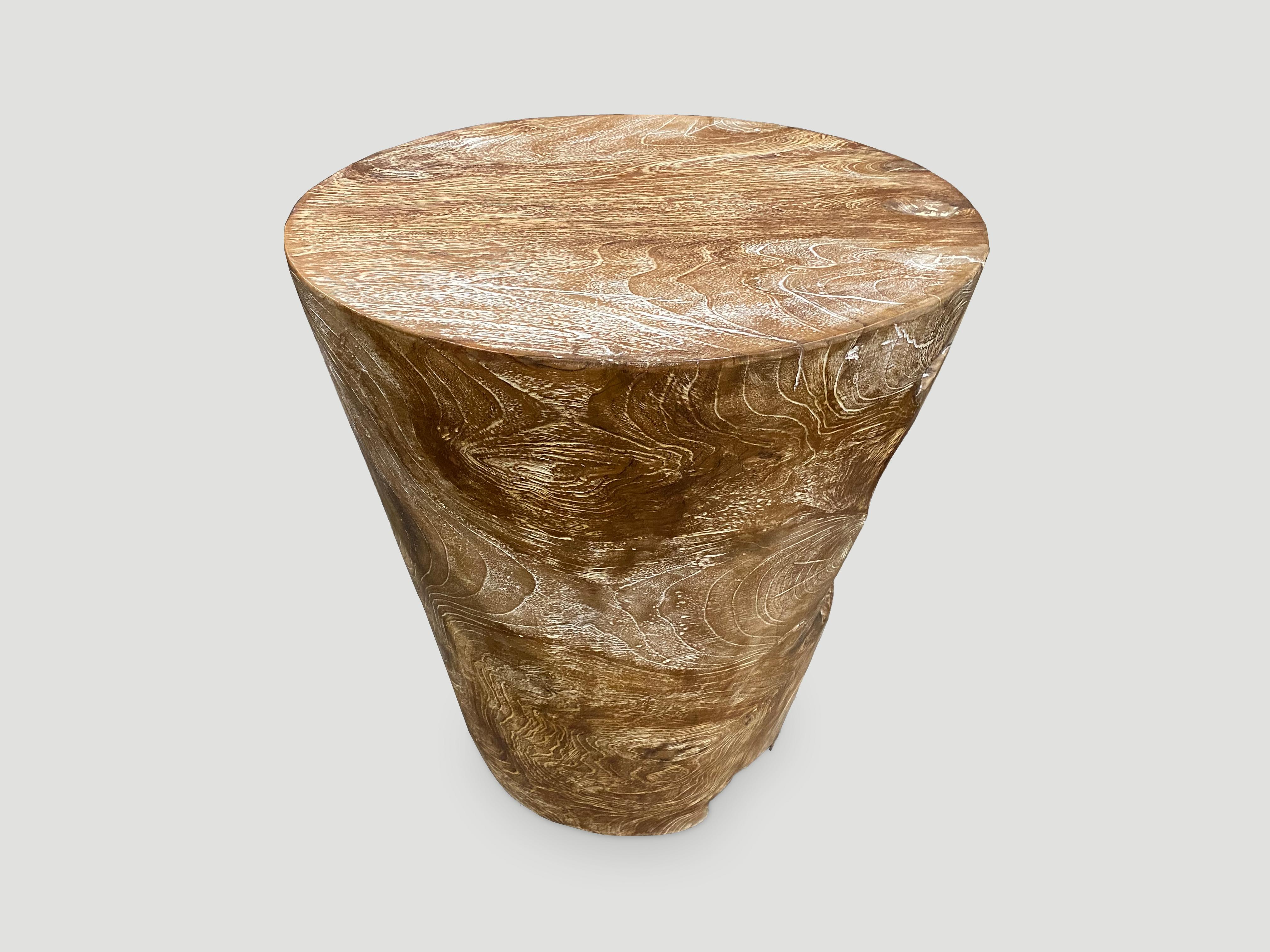 Beautiful natural teak side table hand carved from a single reclaimed teak root with a graduation from the bottom at 12” diameter to 18” at the top.  We added a light ceruse. A perfect combination of modern and organic.

Own an Andrianna Shamaris
