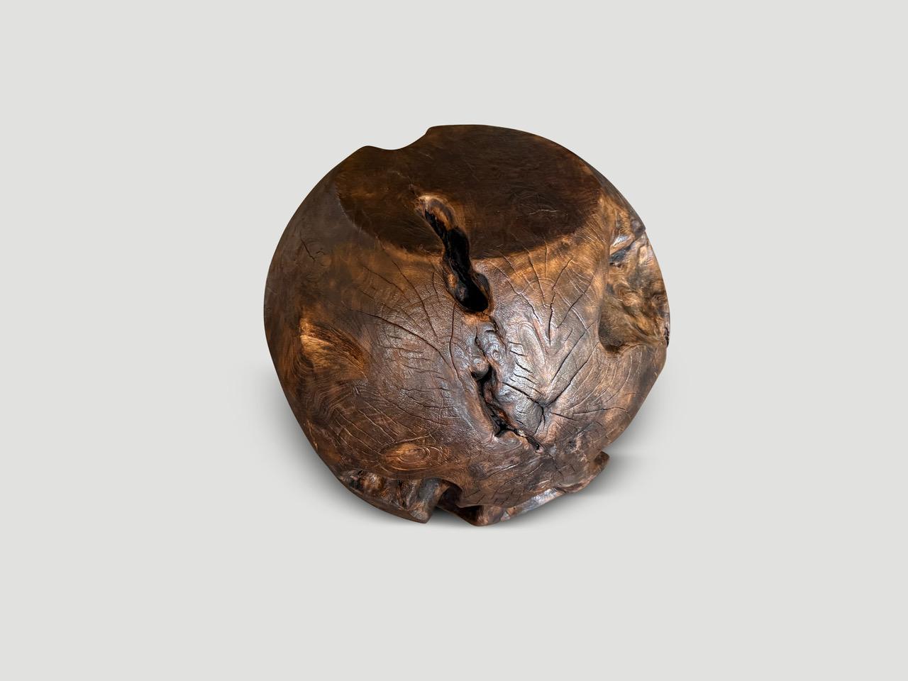 A century old teak root hand carved into a drum shape side table whilst respecting the natural organic wood. Charred one time to a chocolate brown revealing the unique wood grain. Full dimensions; Top 12” diameter x 21” diameter at the side x 18″