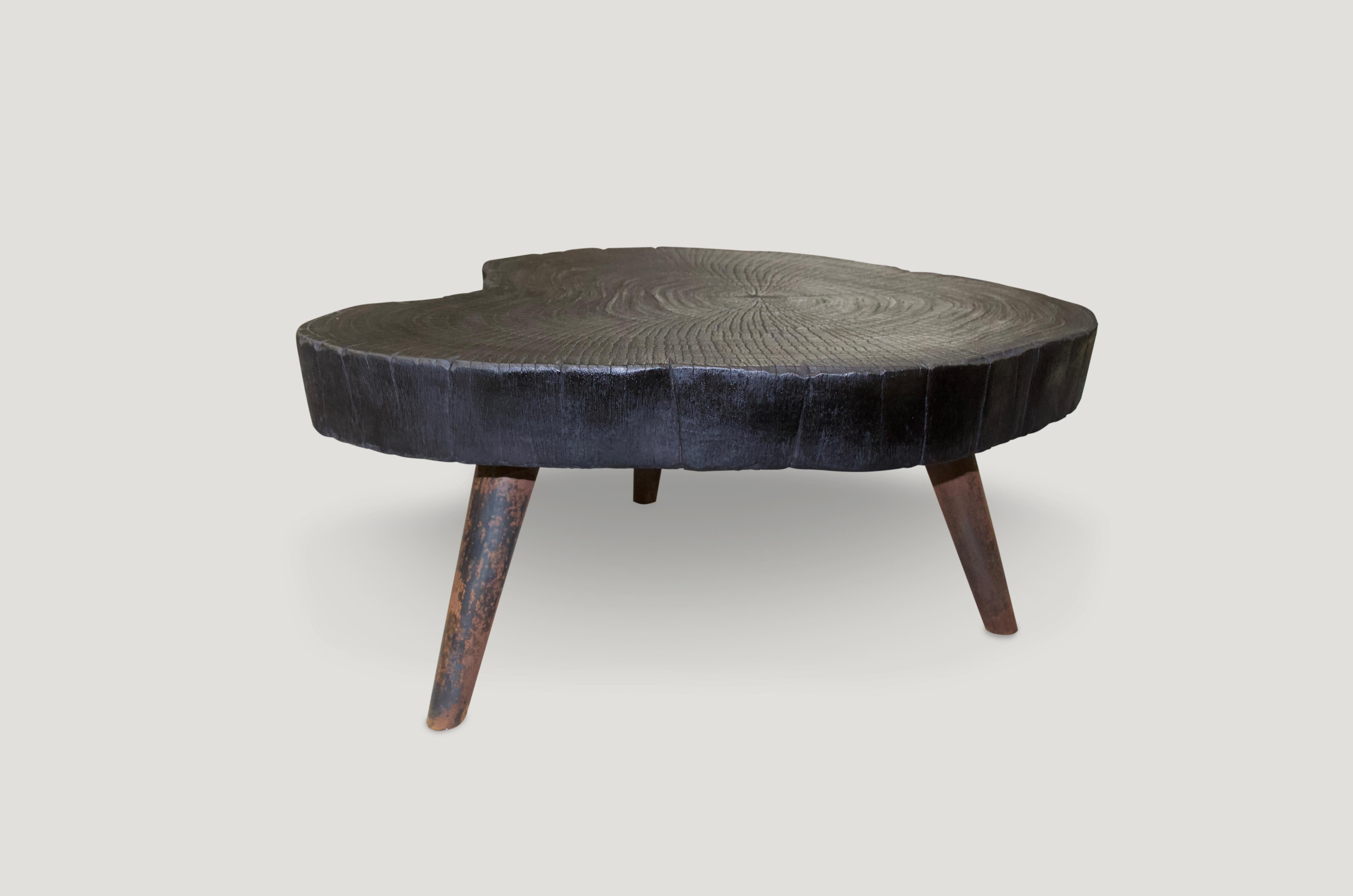 Single four inch slab coffee table. Charred and set on a mid century style burnt metal base, which we can also finish In pure black if preferred. We have a collection available, all sliced from the same log. The price represents one.

The Triple