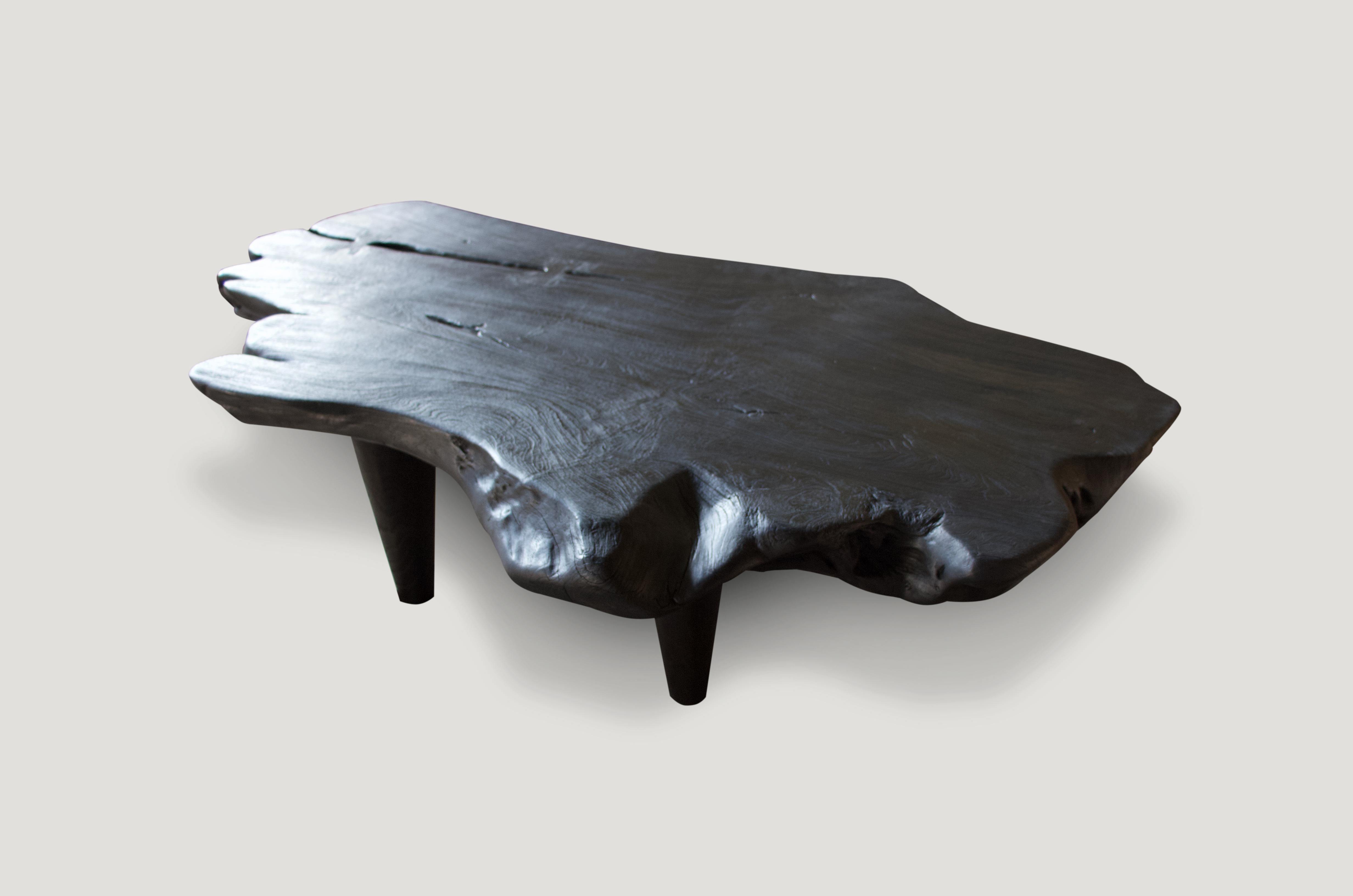 Single slab reclaimed teak wood coffee table with added butterfly details, set on midcentury style legs. A perfect combination of modern and organic.

The Triple Burnt collection represents a unique line of modern furniture made from solid organic