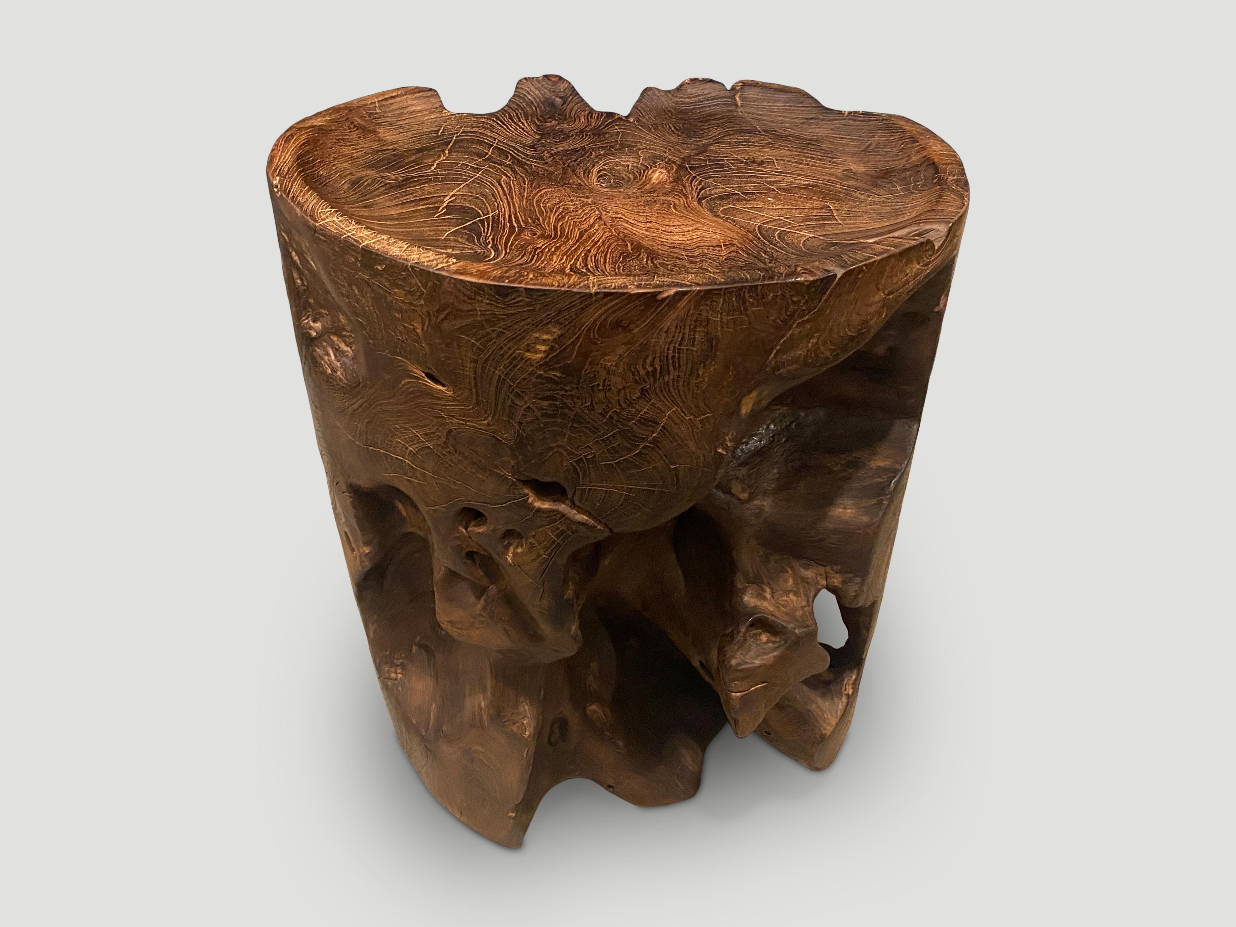Natural organic formed reclaimed teak root side table. We hand carved the top section into a tray style and charred the aged teak revealing the beautiful wood grain. We have a collection. All unique. The price and size reflect the one shown. 

The