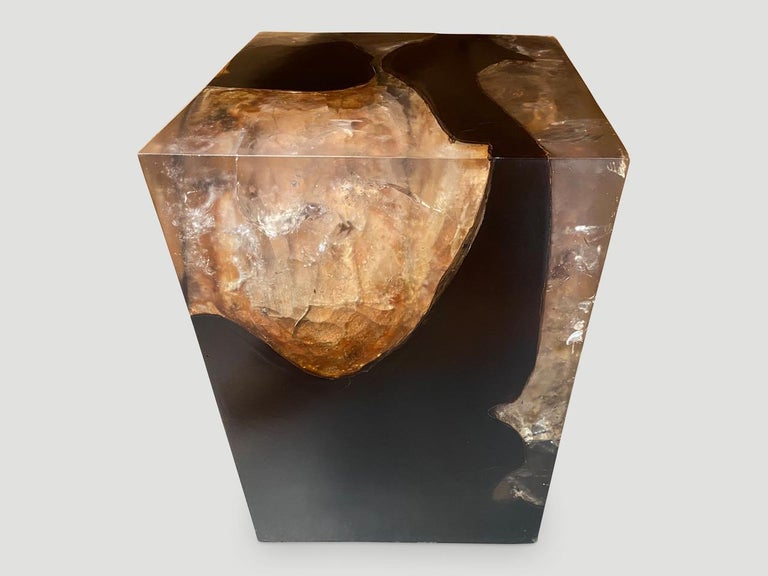 The cracked resin side table is made from reclaimed teak infused with resin. A dramatic piece due to the depth of the resin, which resembles a unique quartz crystal with many different facets. An impressive addition to any space.

The Cracked